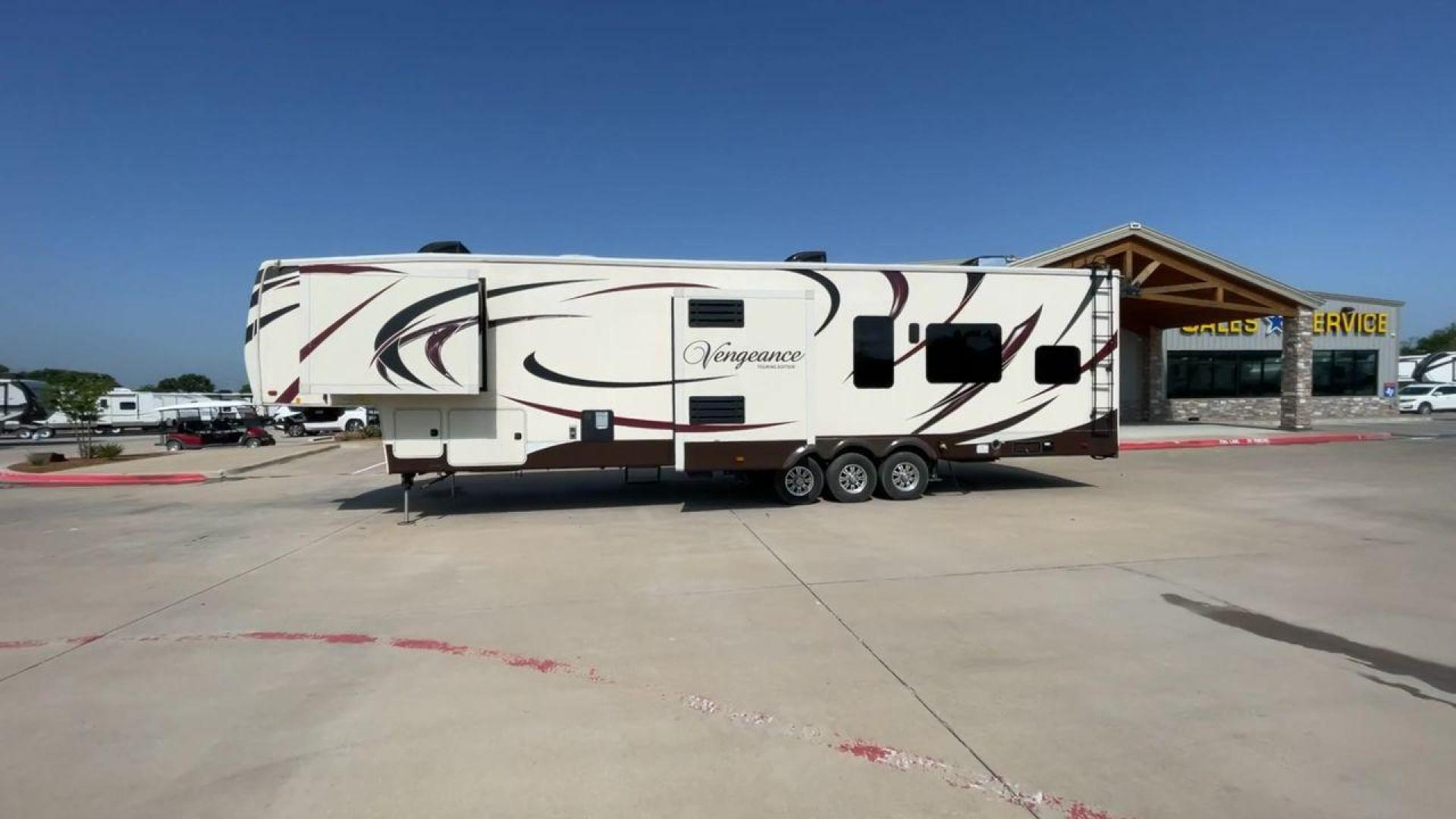 2016 FOREST RIVER VENGEANCE 38L12 (4X4FVGP36GR) , Length: 42.83 ft | Dry Weight: 14,814 lbs | Gross Weight: 18,000 lbs | Slides: 3 transmission, located at 4319 N Main St, Cleburne, TX, 76033, (817) 678-5133, 32.385960, -97.391212 - The 2016 Forest River Vengeance 38L12 is a luxury fifth-wheel toy hauler that provides a spacious and comfortable living area for all of your activities. With a length of roughly 42.83 feet and a dry weight of 14,814 pounds, this RV offers enough space and durability to meet your demands. With an al - Photo#6