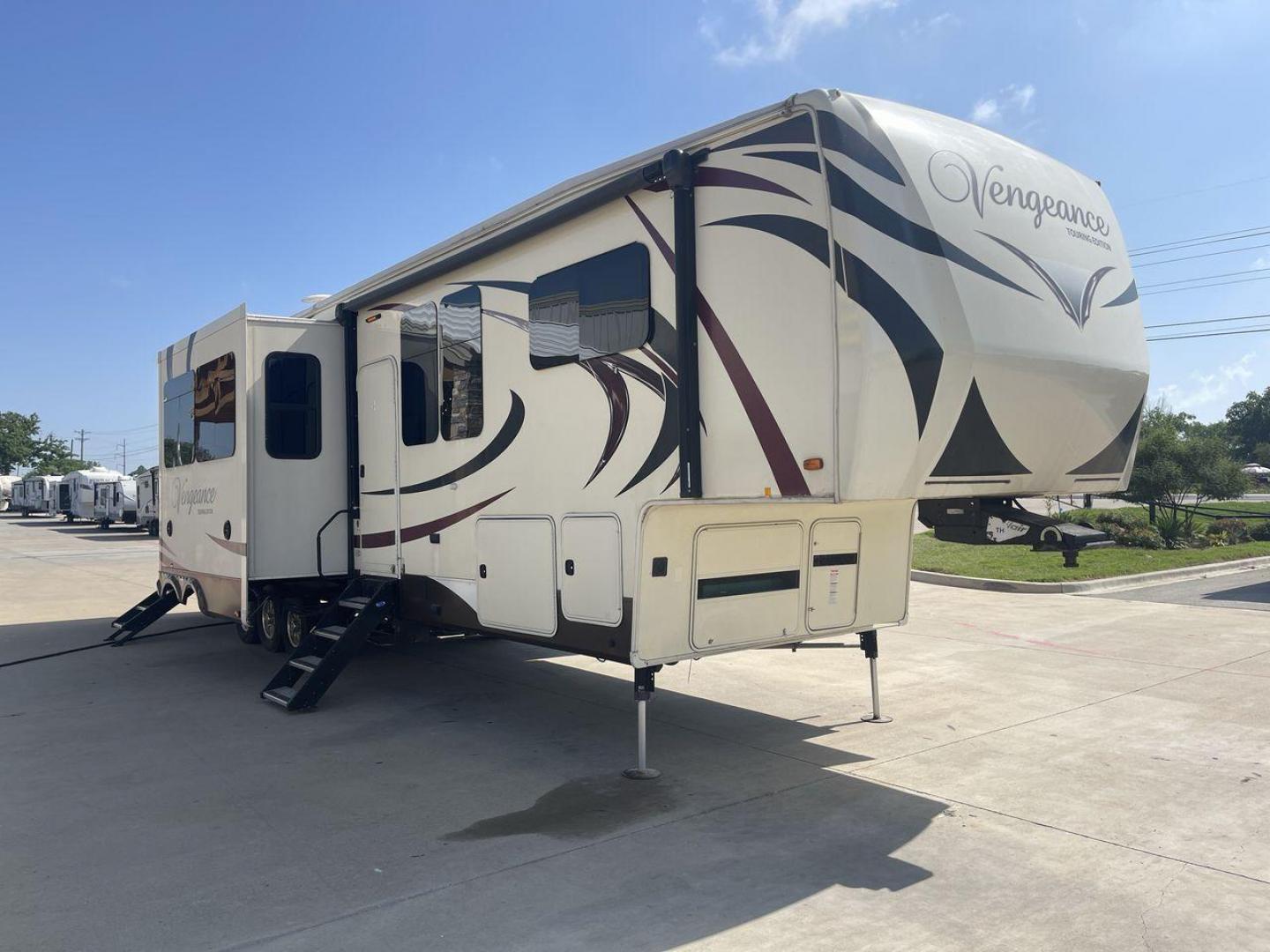 2016 FOREST RIVER VENGEANCE 38L12 (4X4FVGP36GR) , Length: 42.83 ft | Dry Weight: 14,814 lbs | Gross Weight: 18,000 lbs | Slides: 3 transmission, located at 4319 N Main St, Cleburne, TX, 76033, (817) 678-5133, 32.385960, -97.391212 - The 2016 Forest River Vengeance 38L12 is a luxury fifth-wheel toy hauler that provides a spacious and comfortable living area for all of your activities. With a length of roughly 42.83 feet and a dry weight of 14,814 pounds, this RV offers enough space and durability to meet your demands. With an al - Photo#27