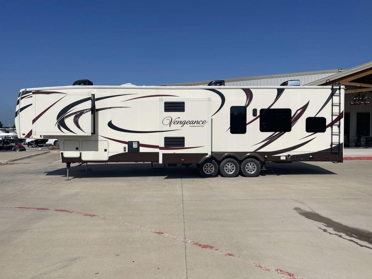 2016 FOREST RIVER VENGEANCE 38L12 (4X4FVGP36GR) , Length: 42.83 ft | Dry Weight: 14,814 lbs | Gross Weight: 18,000 lbs | Slides: 3 transmission, located at 4319 N Main St, Cleburne, TX, 76033, (817) 678-5133, 32.385960, -97.391212 - The 2016 Forest River Vengeance 38L12 is a luxury fifth-wheel toy hauler that provides a spacious and comfortable living area for all of your activities. With a length of roughly 42.83 feet and a dry weight of 14,814 pounds, this RV offers enough space and durability to meet your demands. With an al - Photo#28