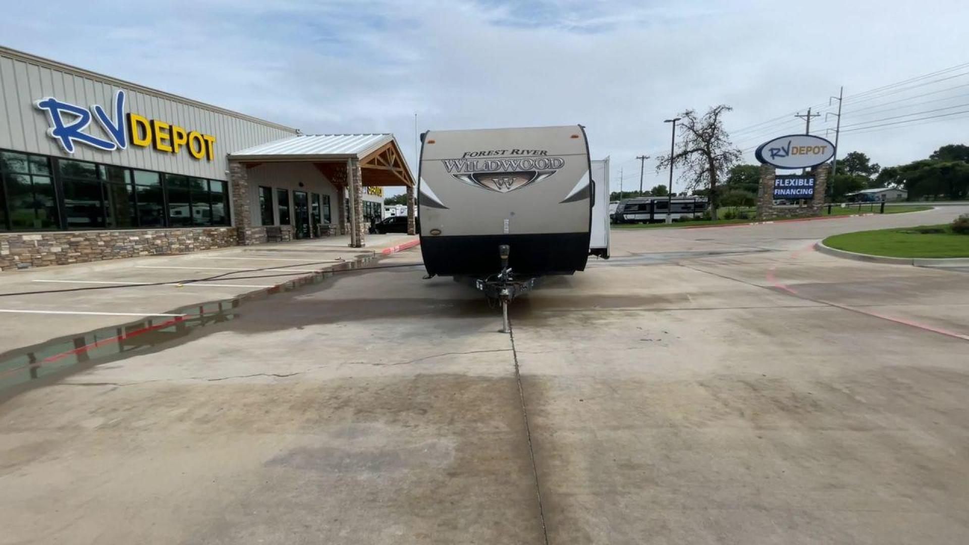 2016 WHITE FOREST RIVER WILDWOOD 28DBUD (4X4TWDD25GA) , Length: 29.83 ft. | Dry Weight: 5,847 lbs. | Slides: 1 transmission, located at 4319 N Main St, Cleburne, TX, 76033, (817) 678-5133, 32.385960, -97.391212 - This 2016 Forest River Wildwood 28DBUD measures just a bit under 30 ft. in length. It has a dry weight of 5,847 lbs. and a payload capacity of 1,920 lbs. It is a dual-axle steel wheel set-up with 1 power-retractable slide and a 16-foot power-retractable awning. Inside, you will find a spacious m - Photo#4