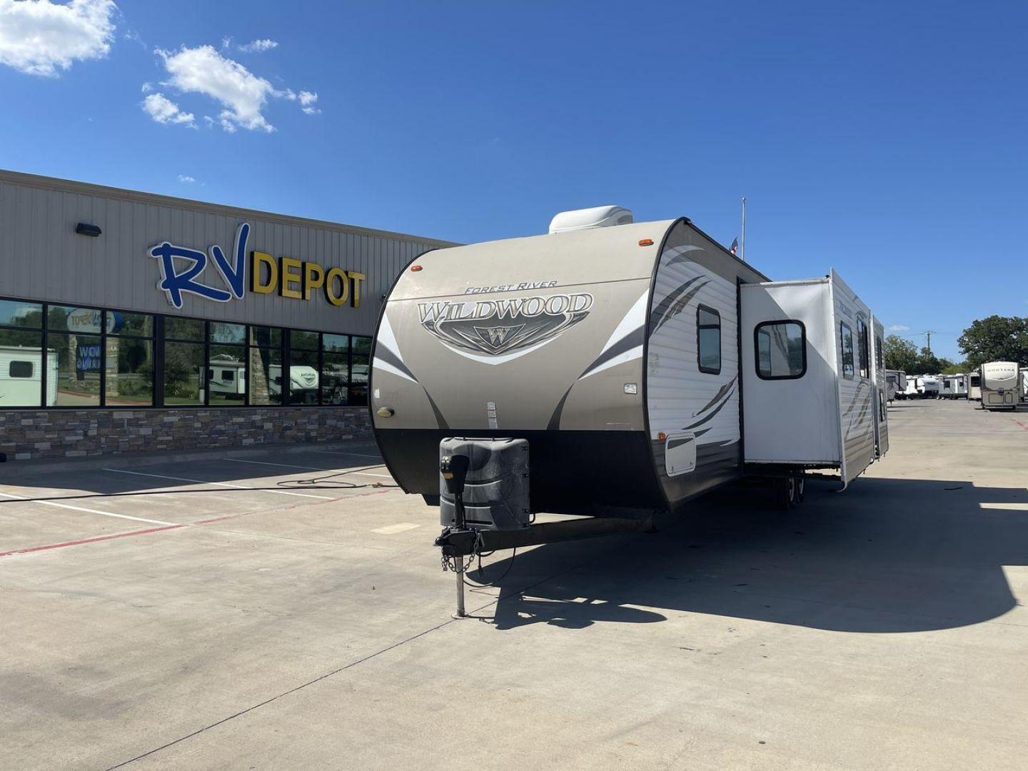 2016 FOREST RIVER WILDWOOD 31QBTS (4X4TWDG27G8) , Length: 35.5 ft. | Dry Weight: 8,140 lbs. | Slides: 3 transmission, located at 4319 N Main St, Cleburne, TX, 76033, (817) 678-5133, 32.385960, -97.391212 - Photo#0