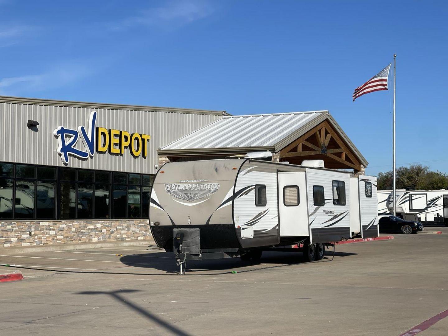 2016 FOREST RIVER WILDWOOD 32BHDS (4X4TWDH24GA) , Length: 35.67 ft. | Dry Weight: 7,955 lbs. | Slides: 2 transmission, located at 4319 N Main St, Cleburne, TX, 76033, (817) 678-5133, 32.385960, -97.391212 - Photo#0