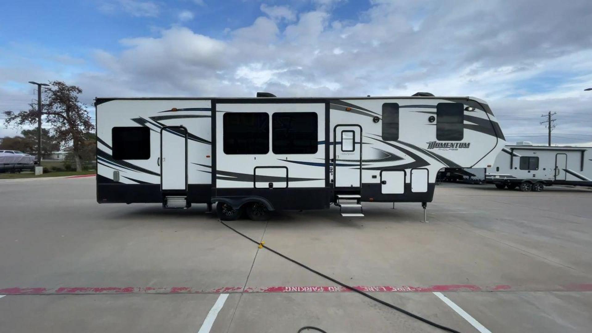 2016 GRAY GRAND DESIGN MOMENTUM 350M (573FM4025G1) , located at 4319 N Main St, Cleburne, TX, 76033, (817) 678-5133, 32.385960, -97.391212 - VIRGINIA TITLE, WILL NEED ORIGINAL INSPECTION - Photo#2