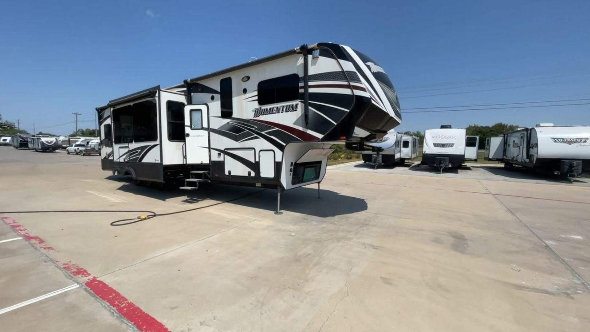 2016 GRAND DESIGN MOMENTUM 397TH (573FM4530G1) , Length: 43.25 ft. | Dry Weight: 15,500 lbs. | Gross Weight: 19,500 lbs. | Slides: 3 transmission, located at 4319 N Main St, Cleburne, TX, 76033, (817) 678-5133, 32.385960, -97.391212 - Photo#3