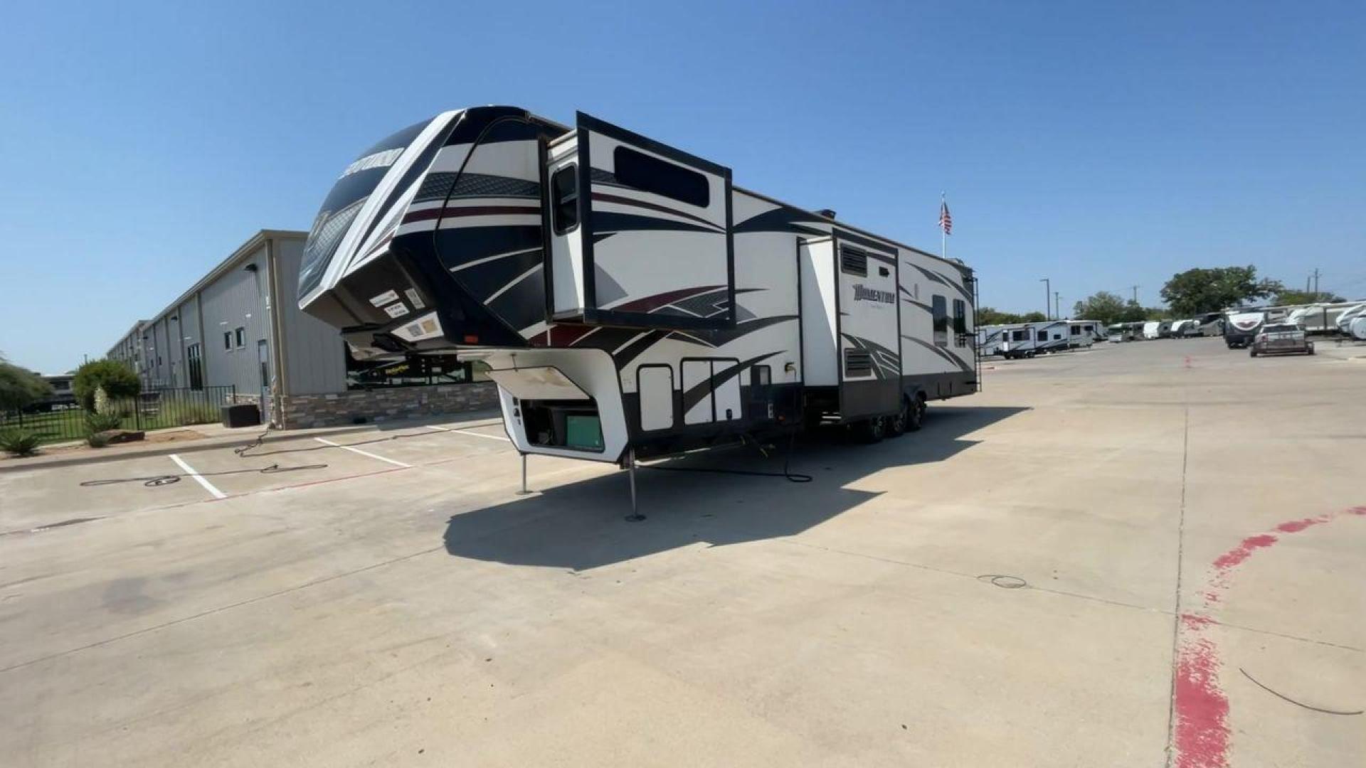 2016 GRAND DESIGN MOMENTUM 397TH (573FM4530G1) , Length: 43.25 ft. | Dry Weight: 15,500 lbs. | Gross Weight: 19,500 lbs. | Slides: 3 transmission, located at 4319 N Main St, Cleburne, TX, 76033, (817) 678-5133, 32.385960, -97.391212 - Photo#5