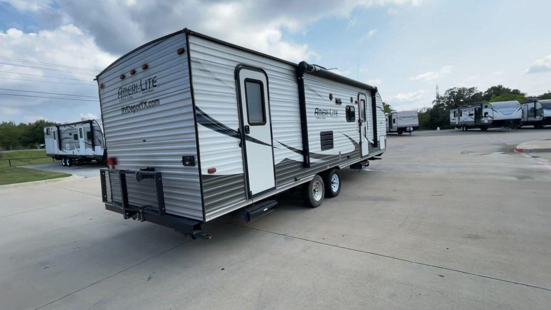 2016 GRAY GULFSTREAM AMERILITE 268BH (1NL1GTM29G1) , Length: 29.33 ft. | Dry Weight: 5,220 lbs. | Slides: 1 transmission, located at 4319 N Main St, Cleburne, TX, 76033, (817) 678-5133, 32.385960, -97.391212 - Photo#1