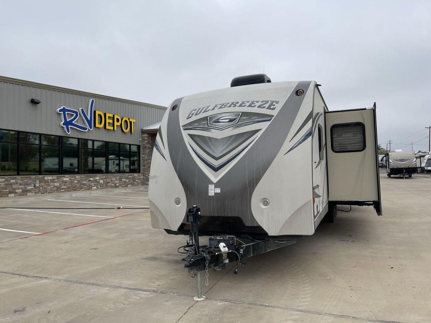 2016 TAN GULF BREEZE 30DBS - (1NL1XTP26G1) , Length: 35.33 ft. | Dry Weight: 6,640 lbs. | Slides: 2 transmission, located at 4319 N Main St, Cleburne, TX, 76033, (817) 678-5133, 32.385960, -97.391212 - Explore more reasons that emphasize the benefits of having this RV as your own. (1) This model boasts upgraded décor with high-quality finishes, plush furniture, and stylish accents (2) The bedroom features a walk-around queen-size bed with ample storage and a private entrance to the bathroom - Photo#0