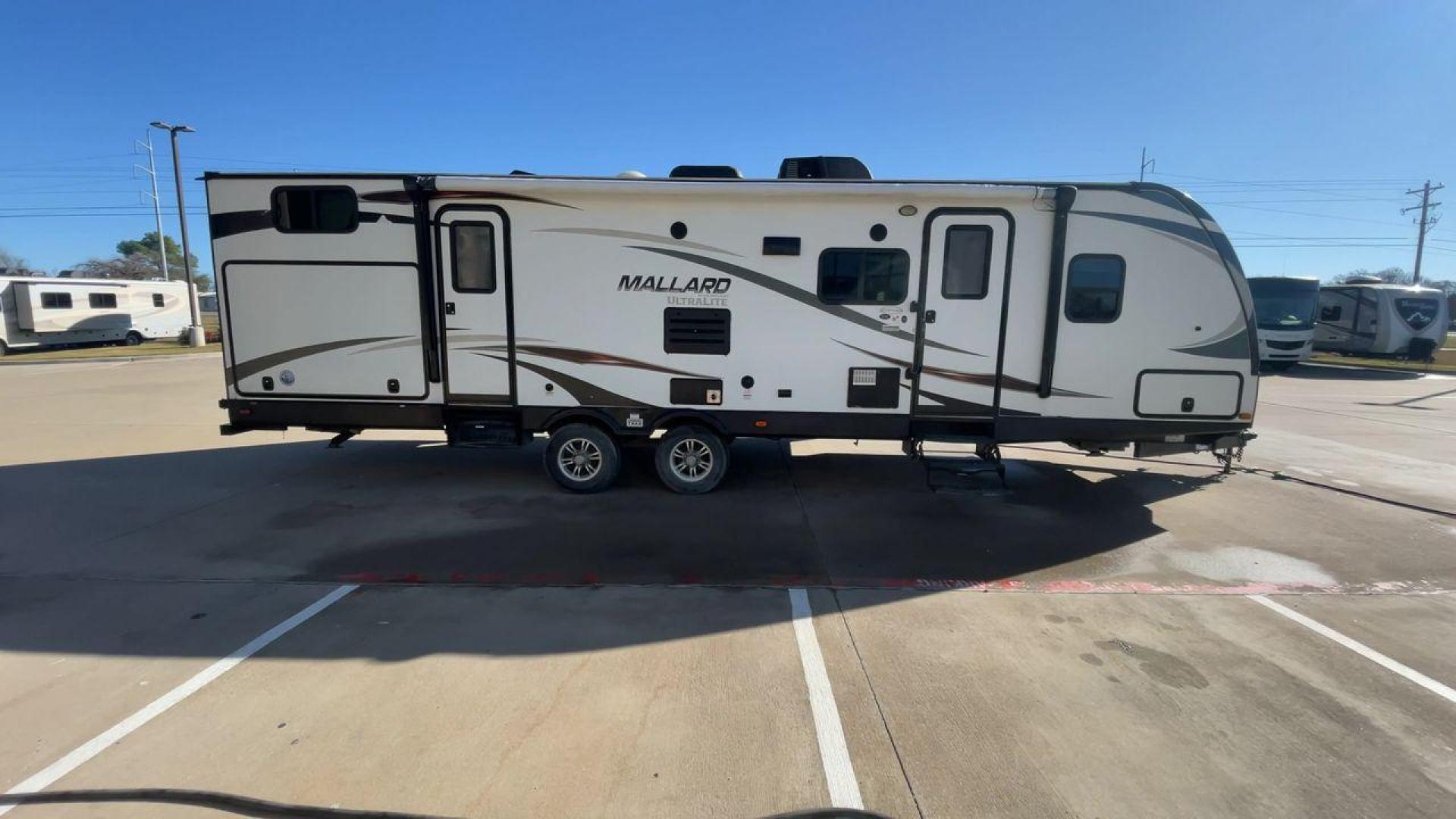 2016 HEARTLAND MALLARD M32 (5SFNB3423GE) , Length: 34.7 ft. | Dry Weight: 6,700 lbs. | Gross Weight: 8,600 lbs. | Slides: 2 transmission, located at 4319 N Main St, Cleburne, TX, 76033, (817) 678-5133, 32.385960, -97.391212 - "The 2016 Heartland Mallard M32 is a spacious and versatile travel trailer designed to make your camping adventures comfortable and memorable. With a length of 34.7 ft., a width of 8 ft., and a height of 11.33 ft., this unit offers plenty of room for family and friends. It has a dry weight of 6,700 - Photo#2