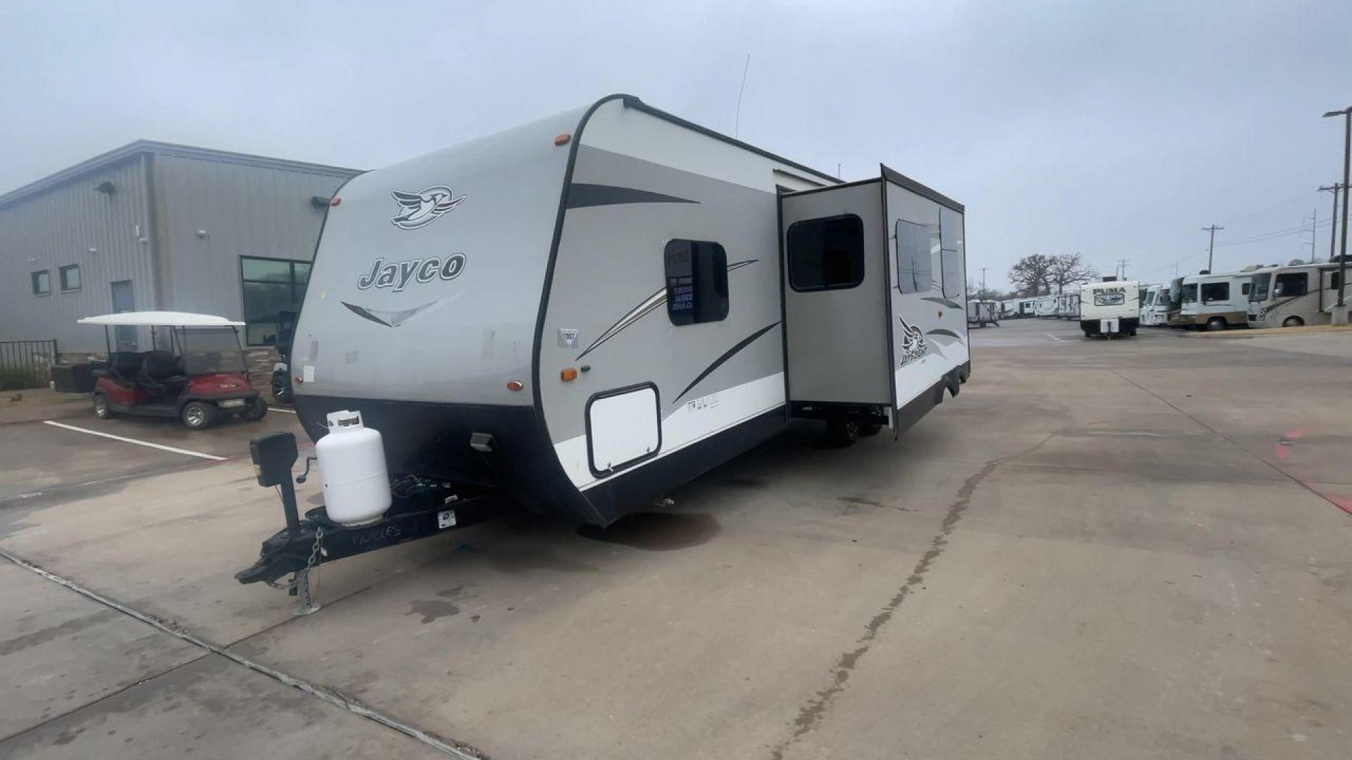 2016 JAYCO JAYFLIGHT 27BH (1UJBJ0BP9G7) , Length: 30 ft | Slides: 1 transmission, located at 4319 N Main St, Cleburne, TX, 76033, (817) 678-5133, 32.385960, -97.391212 - The 2016 Jayco Jay Flight 27BH is a 30-foot travel trailer built for comfort and adventure. Its exterior features a sleek, aerodynamic front with Jayco’s signature graphics and durable aluminum siding. The single slide expands the living space. The dual-axle design with stylish alloy wheels ensure - Photo#5