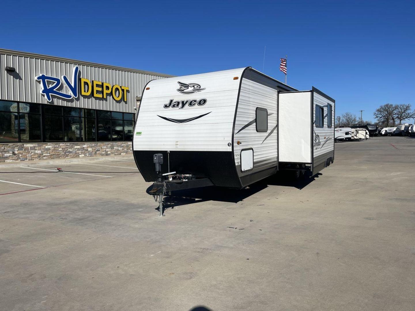 2016 WHITE JAYFLIGHT 287BHSW - (1UJBJ0BR5G1) , located at 4319 N Main St, Cleburne, TX, 76033, (817) 678-5133, 32.385960, -97.391212 - Discover extra features that contribute to making this RV an ideal investment. (1) Easily access dry goods and kitchen essentials from both inside and outside the trailer through the convenient pass-through pantry. (2) Its dinette with booth seating provides ample space for meals, game nights, a - Photo#0