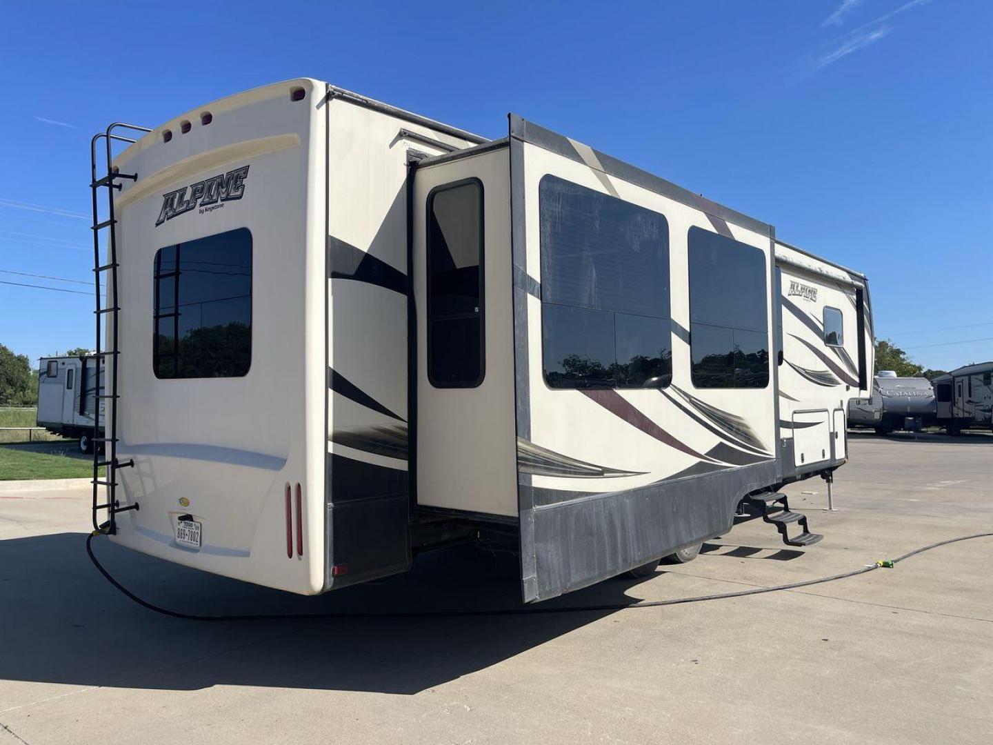 2016 WHITE KEYSTONE ALPINE 3511RE (4YDF35124GE) , Length: 39.17 ft. | Dry Weight: 13,100 lbs. | Gross Weight: 15,500 lbs. | Slides: 4 transmission, located at 4319 N Main St, Cleburne, TX, 76033, (817) 678-5133, 32.385960, -97.391212 - The 2016 Keystone Alpine 3511RE Fifth Wheel offers a spacious and luxurious home on wheels, measuring 39.17 feet in length. It has a dry weight of 13,100 lbs and a gross weight of 15,500 lbs, making it a solid choice for those looking for both comfort and durability during extended travels. With fou - Photo#0