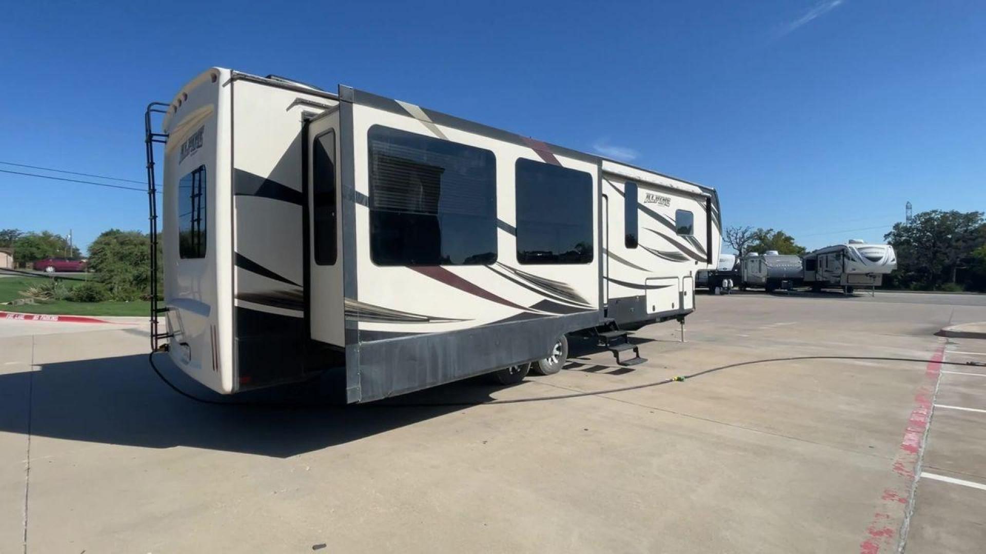 2016 WHITE KEYSTONE ALPINE 3511RE (4YDF35124GE) , Length: 39.17 ft. | Dry Weight: 13,100 lbs. | Gross Weight: 15,500 lbs. | Slides: 4 transmission, located at 4319 N Main St, Cleburne, TX, 76033, (817) 678-5133, 32.385960, -97.391212 - The 2016 Keystone Alpine 3511RE Fifth Wheel offers a spacious and luxurious home on wheels, measuring 39.17 feet in length. It has a dry weight of 13,100 lbs and a gross weight of 15,500 lbs, making it a solid choice for those looking for both comfort and durability during extended travels. With fou - Photo#1