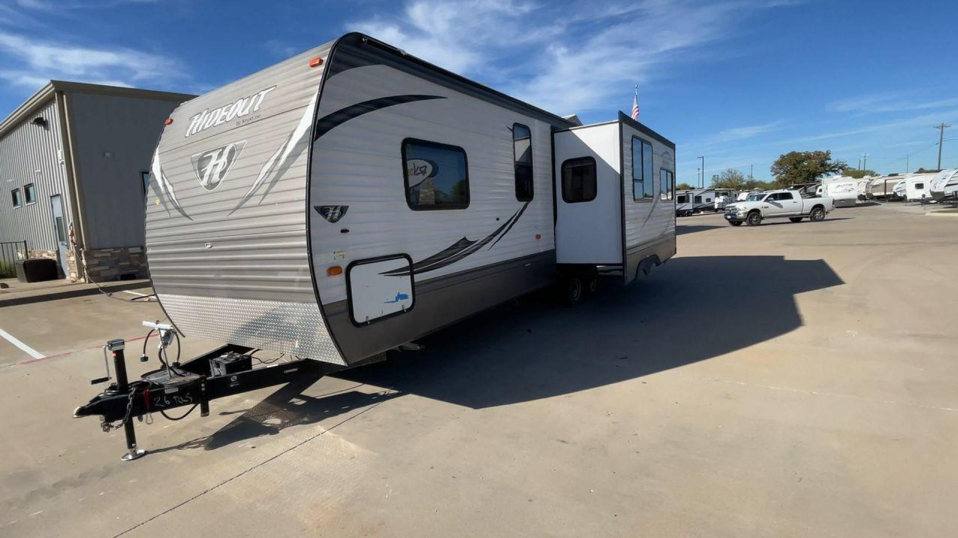 2016 KEYSTONE HIDEOUT (4YDT26R2XG7) , Length: 29.92 ft | Dry Weight: 6,334 lbs | Gross Weight: 7,835 lbs | Slides: 1 transmission, located at 4319 N Main St, Cleburne, TX, 76033, (817) 678-5133, 32.385960, -97.391212 - The Hideout 26RLS by 26RLS travel trailer is a small, half-ton towable, inexpensive camper. It is 29.92 ft in length, 8 ft in width, and 11 ft in height. The dry weight is 6,334 lbs with a payload capacity of 1,501 lbs. The trailer has a GVWR of 7,835 lbs and a hitch weight of 835 lbs. It features l - Photo#5