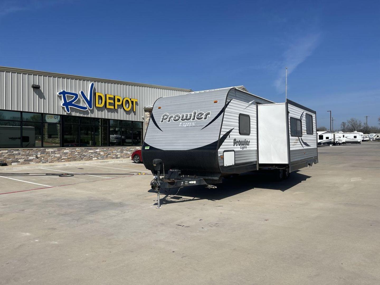 2016 KEYSTONE PROWLER 30LX (5SFPB3324GE) , Length: 33.92 ft. | Dry Weight: 6,720 lbs. | Gross Weight: 9,000 lbs. | Slides: 1 transmission, located at 4319 N Main St, Cleburne, TX, 76033, (817) 678-5133, 32.385960, -97.391212 - The 2016 Keystone Prowler 30LX is a travel trailer designed to make our camping experiences extraordinary. With a dry weight of 6,720 lbs. and a gross weight of 9,000 lbs., this Heartland Prowler 30LX is lightweight yet sturdy. It is equipped with a single slide, which adds extra living space when e - Photo#0