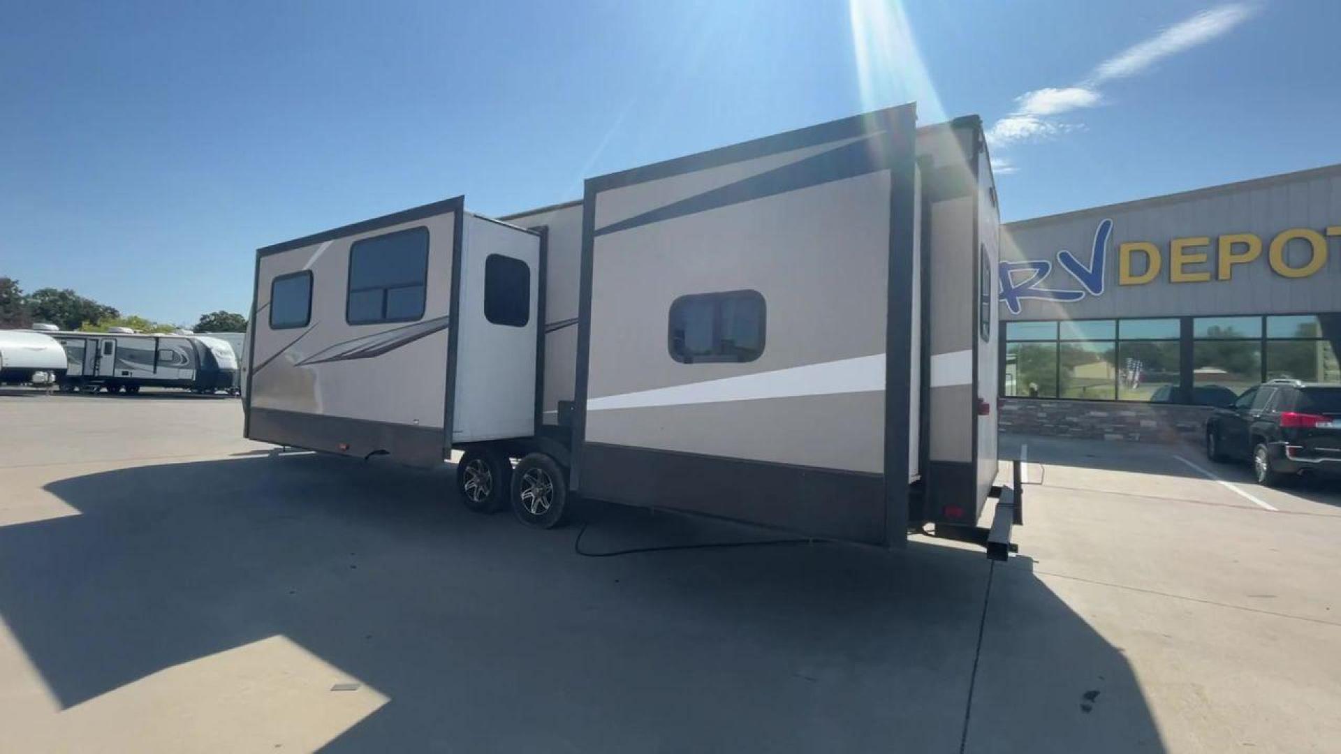 2016 TAN LAYTON 305BH - (5ZWTYTS21G4) , Length: 36.5 ft. | Dry Weight: 6,885 lbs. | Gross Weight: 11,200 lbs. | Slides: 2 transmission, located at 4319 N Main St, Cleburne, TX, 76033, (817) 678-5133, 32.385960, -97.391212 - Go on your next trip with the 2016 Layton 305BH, a travel trailer that is roomy and well-equipped for comfort and ease of use. This RV provides ample space for the entire family to enjoy, measuring 36.5 feet in length and weighing 6,885 pounds when dry and 11,200 pounds when fully loaded. With two s - Photo#7