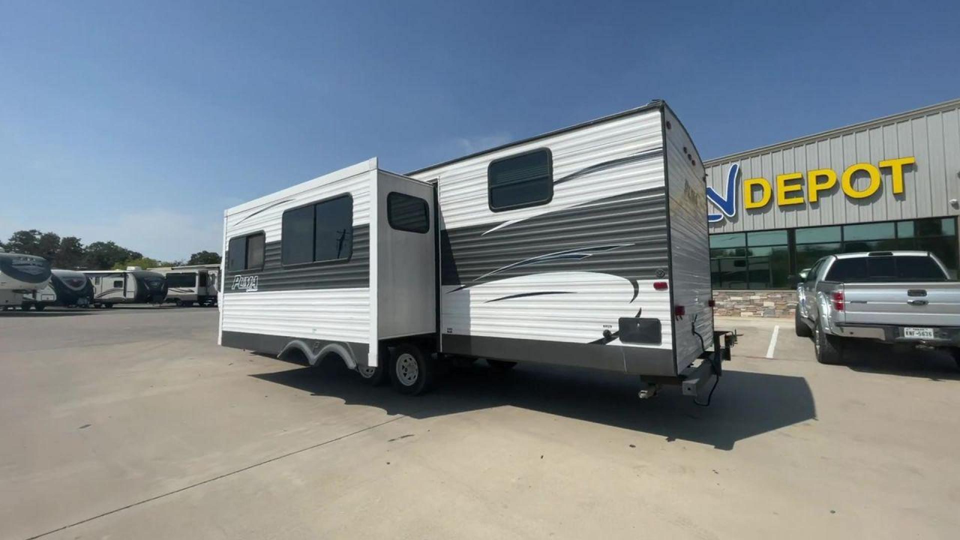 2016 SILVER PALOMINO PUMA 30DBSC (4X4TPUF25GP) , Length: 33.42 ft. | Dry Weight: 6,300 lbs. | Gross Weight: 8,000 lbs. | Slides: 1 transmission, located at 4319 N Main St, Cleburne, TX, 76033, (817) 678-5133, 32.385960, -97.391212 - Make the most of your next camping trip with the whole family in this 2016 Puma 30DBSC! This travel trailer has a length of 33.42 ft. and a height of 10.75 ft. It also has a dry weight of 6,300 lbs. and a GVWR of 8,000 lbs. It comes equipped with one power slide as well as one power awning. Immediat - Photo#7