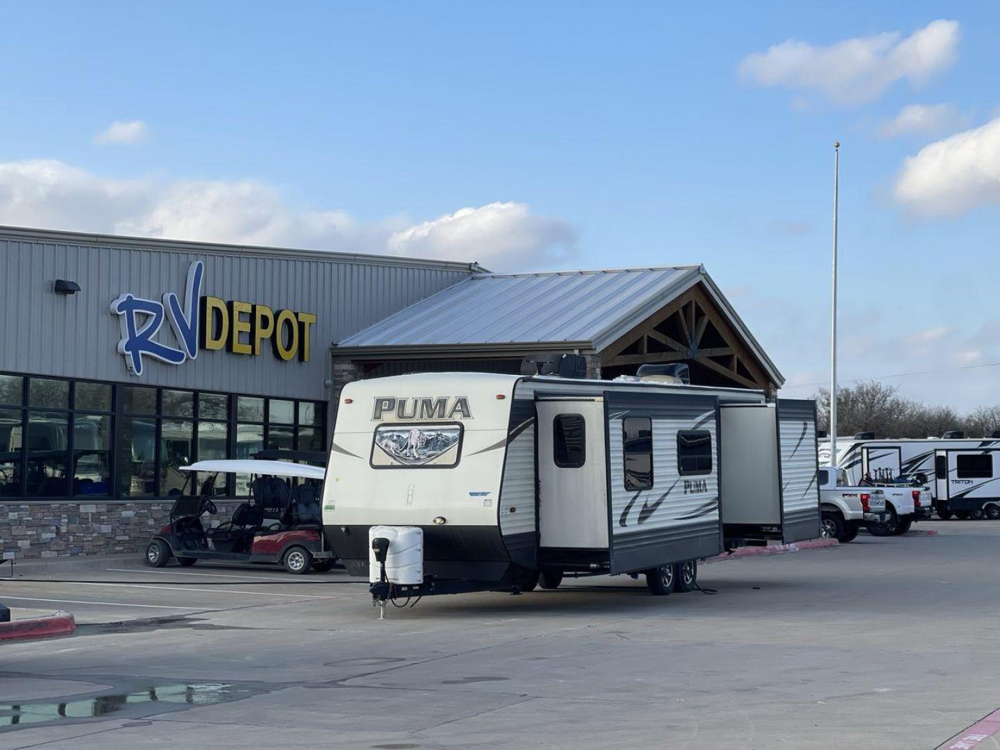 2016 TAN PALOMINO PUMA 30FKSS (4X4TPUF20GP) , Length: 34.75 ft. | Dry Weight: 7,992 lbs. | Gross Weight: 9,950 lbs. | Slides: 2 transmission, located at 4319 N Main St, Cleburne, TX, 76033, (817) 678-5133, 32.385960, -97.391212 - Take advantage of the 2016 Palomino Puma 30FKSS Travel Trailer and embrace the spirit of adventure. With its stylish, functional, and comfortable design, this travel trailer provides a cozy living area for your road trips. This unit has dimensions of 34.75 ft in length, 8 ft in width, and 11.08 ft i - Photo#0