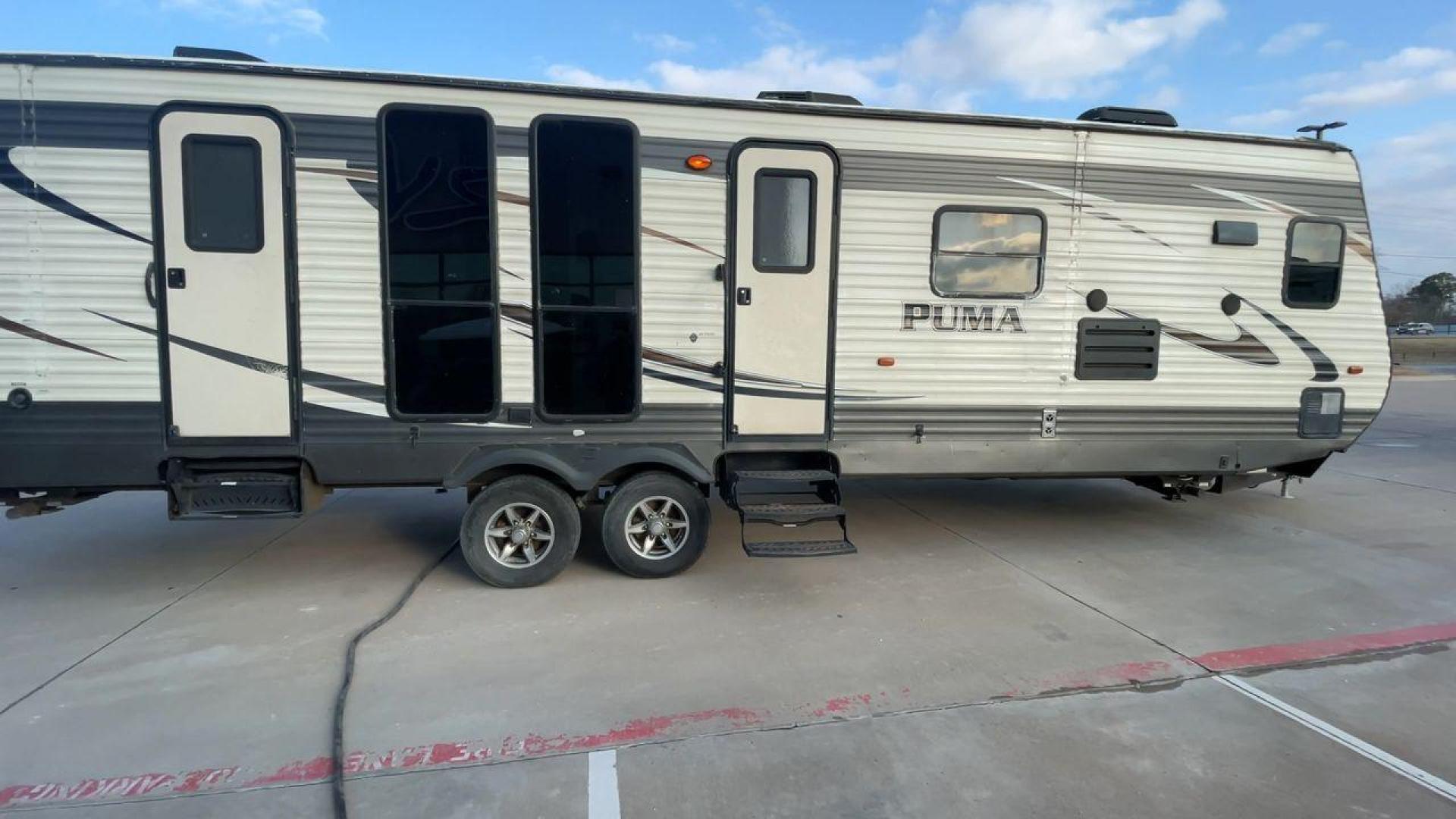 2016 TAN PALOMINO PUMA 30FKSS (4X4TPUF20GP) , Length: 34.75 ft. | Dry Weight: 7,992 lbs. | Gross Weight: 9,950 lbs. | Slides: 2 transmission, located at 4319 N Main St, Cleburne, TX, 76033, (817) 678-5133, 32.385960, -97.391212 - Take advantage of the 2016 Palomino Puma 30FKSS Travel Trailer and embrace the spirit of adventure. With its stylish, functional, and comfortable design, this travel trailer provides a cozy living area for your road trips. This unit has dimensions of 34.75 ft in length, 8 ft in width, and 11.08 ft i - Photo#2