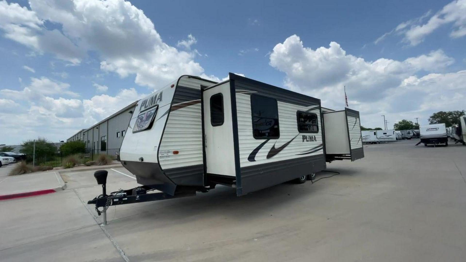 2016 TAN PALOMINO PUMA 30FKSS (4X4TPUF20GP) , Length: 34.75 ft. | Dry Weight: 7,992 lbs. | Gross Weight: 9,950 lbs. | Slides: 2 transmission, located at 4319 N Main St, Cleburne, TX, 76033, (817) 678-5133, 32.385960, -97.391212 - Take advantage of the 2016 Palomino Puma 30FKSS Travel Trailer and embrace the spirit of adventure. With its stylish, functional, and comfortable design, this travel trailer provides a cozy living area for your road trips. This unit has dimensions of 34.75 ft in length, 8 ft in width, and 11.08 ft i - Photo#1