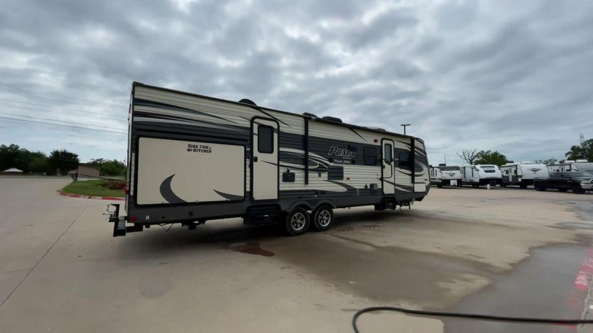 2016 PALOMINO PUMA 31BHSS (4X4TPUG27GP) , Length: 35.33 ft. | Dry Weight: 7,958 lbs. | Gross Weight: 9,600 lbs. | Slides: 2 transmission, located at 4319 N Main St, Cleburne, TX, 76033, (817) 678-5133, 32.385960, -97.391212 - Photo#1