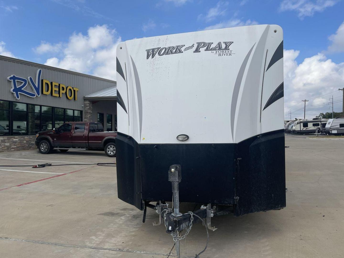 2016 WHITE WORK N PLAY 30FBW (4X4TWPF29GB) , Length: 36 ft. | Dry Weight: 8,928 lbs. | Gross Weight: 13,469 lbs. | Slides: 1 transmission, located at 4319 N Main St, Cleburne, TX, 76033, (817) 678-5133, 32.385960, -97.391212 - The 2016 Forest River Work and Play 30WRS toy hauler has a sizable cargo compartment for storing and transporting your preferred off-road items. You can load up a few dirt motorcycles simply because the cargo space is 10'! This 30WRS model measures 36 ft in length by 8.5 ft in width. It has a dry we - Photo#0