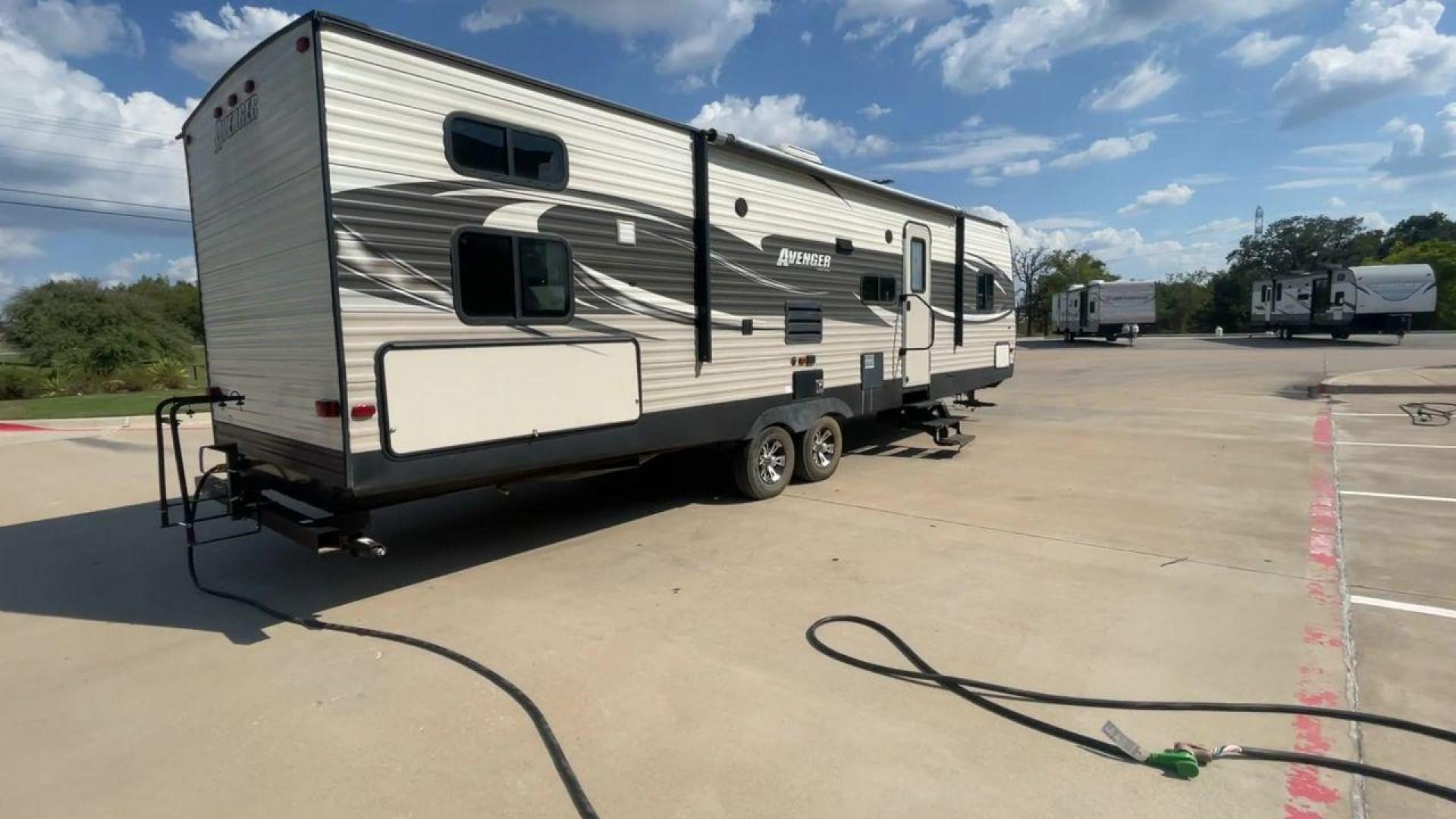 2017 TAN FOREST RIVER AVENGER 31DBS (5ZT2AVWB1HB) , Length: 35.75 ft | Dry Weight: 7,189 lbs. | Gross Weight: 9,589 lbs. | Slides: 1 transmission, located at 4319 N Main St, Cleburne, TX, 76033, (817) 678-5133, 32.385960, -97.391212 - This is the 2017 Forest River Avenger 31DBS. It's your ticket to fun and excitement on the open road with your family. The length of this travel trailer is 35.75 feet and its dry weight is 7,189 lbs. When you walk inside, you'll find a plan that was made for comfort and ease. The bathroom in the bac - Photo#1