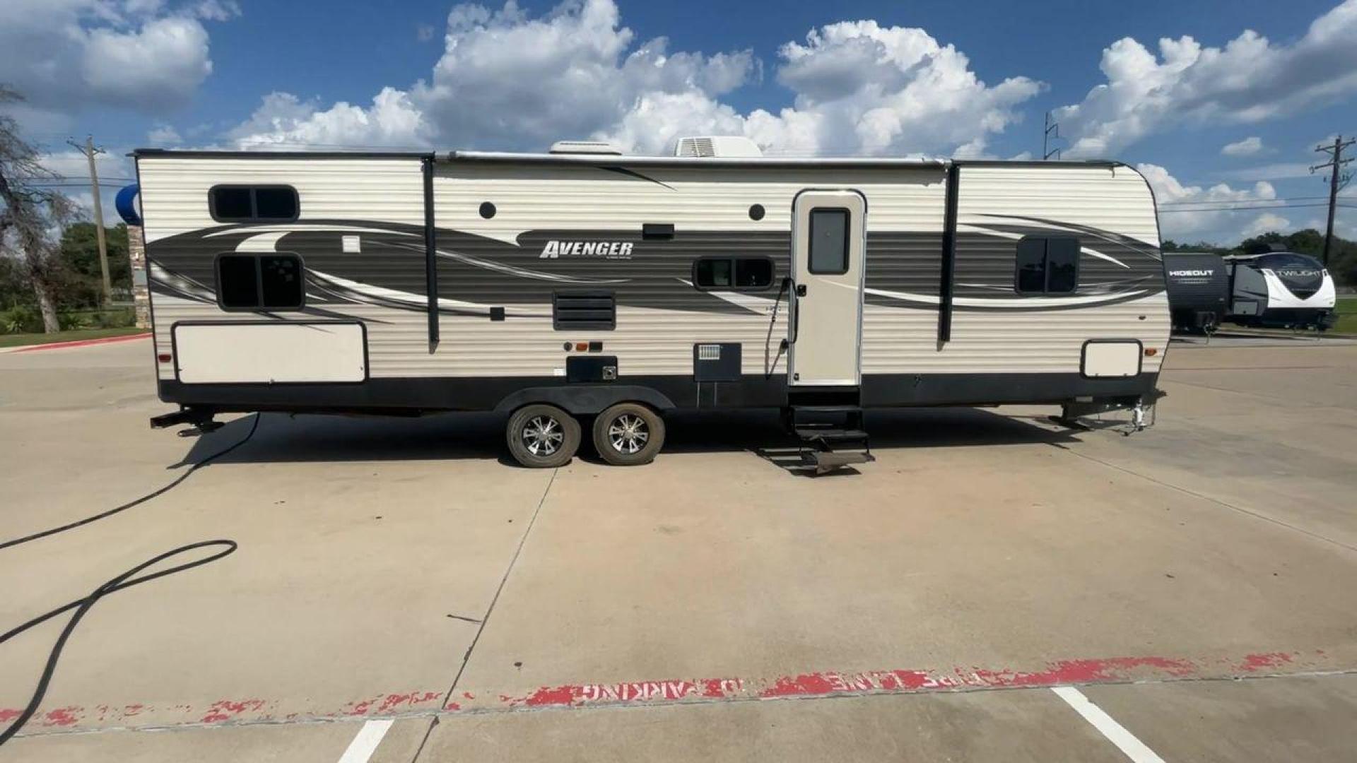 2017 TAN FOREST RIVER AVENGER 31DBS (5ZT2AVWB1HB) , Length: 35.75 ft | Dry Weight: 7,189 lbs. | Gross Weight: 9,589 lbs. | Slides: 1 transmission, located at 4319 N Main St, Cleburne, TX, 76033, (817) 678-5133, 32.385960, -97.391212 - This is the 2017 Forest River Avenger 31DBS. It's your ticket to fun and excitement on the open road with your family. The length of this travel trailer is 35.75 feet and its dry weight is 7,189 lbs. When you walk inside, you'll find a plan that was made for comfort and ease. The bathroom in the bac - Photo#2