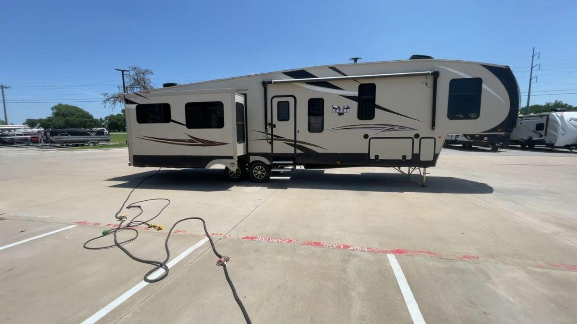 2017 FOREST RIVER SABRE 365MB (4X4FSRN22H3) , Length: 42.42 ft | Dry Weight: 12,994 lbs | Gross Weight: 15,500 lbs | Slides: 4 transmission, located at 4319 N Main St, Cleburne, TX, 76033, (817) 678-5133, 32.385960, -97.391212 - The 2017 Forest River Sabre 365MB is a roomy fifth wheel that is meant to make camping trips more comfortable. With its spacious layout and thoughtful features, this RV provides a luxury home away from home. The unit measures 42.42 feet in length and weighs 12,994 lbs. dry, offers enough space for r - Photo#2