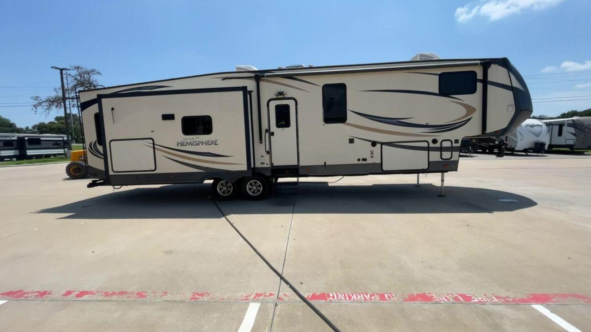 2017 TAN FOREST RIVER SALEM HEMISPHERE (4X4FSBN23HV) , Length: 42 ft.| Dry Weight: 10,924 lbs.| Slides: 4 transmission, located at 4319 N Main St, Cleburne, TX, 76033, (817) 678-5133, 32.385960, -97.391212 - This is a 2017 Salem Hemisphere 368RLBHK fifth wheel. It has dimensions of 42 ft in length, 8 ft in width, and a 13.17 ft height. It has a dry weight of 10,924 lbs and a payload capacity of 3,156 lbs with a hitch weight of 2,080 lbs. This comes with four power-retractable slideouts and one 19 ft pow - Photo#2