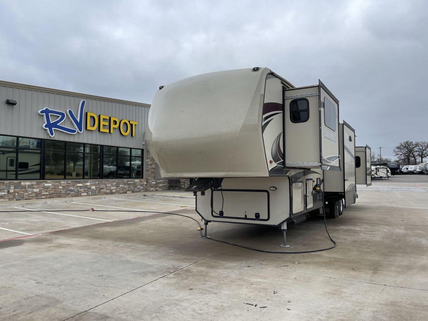 2017 BROWN FOREST RIVER SANIBEL 3901FL (5ZT3SN4B1HG) , Length: 41.83 ft. | Dry Weight: 13,979 lbs. | Slides: 5 transmission, located at 4319 N Main St, Cleburne, TX, 76033, (817) 678-5133, 32.385960, -97.391212 - The 2017 Forest River Sanibel 3901FL Fifth Wheel delivers luxury and comfort on the road. This fifth wheel, measuring 41.83 feet long and weighing 13,979 pounds dry, provides roomy living accommodations with a plethora of quality conveniences. With five slides and dual entryways, this model offers p - Photo#0