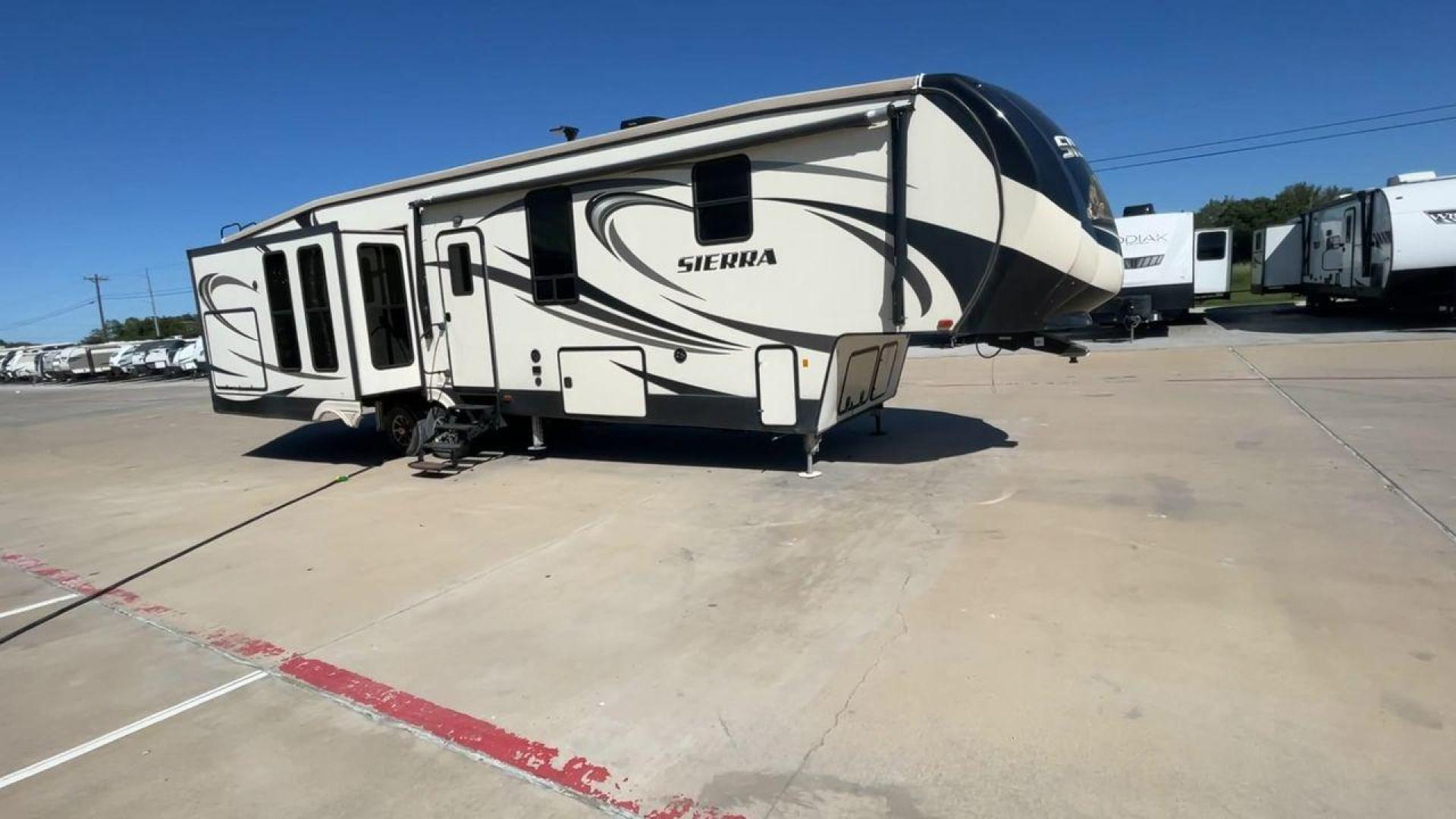 2017 TAN FOREST RIVER SIERRA 378FB (4X4FSEP25HJ) , Length: 42.58 ft. | Dry Weight: 12,455 lbs. | Gross Weight: 15,500 lbs. | Slides: 3 transmission, located at 4319 N Main St, Cleburne, TX, 76033, (817) 678-5133, 32.385960, -97.391212 - The 2017 Forest River Sierra 378FB is a dual-axle aluminum wheel set-up that measures 42.58 ft. in length. It has a dry weight of 12,455 lbs. and a GVWR of 15,500 lbs. This fifth wheel is big, spacious, and luxurious! On the exterior, you can enjoy an enormous 20-foot power-retractable awning and an - Photo#3