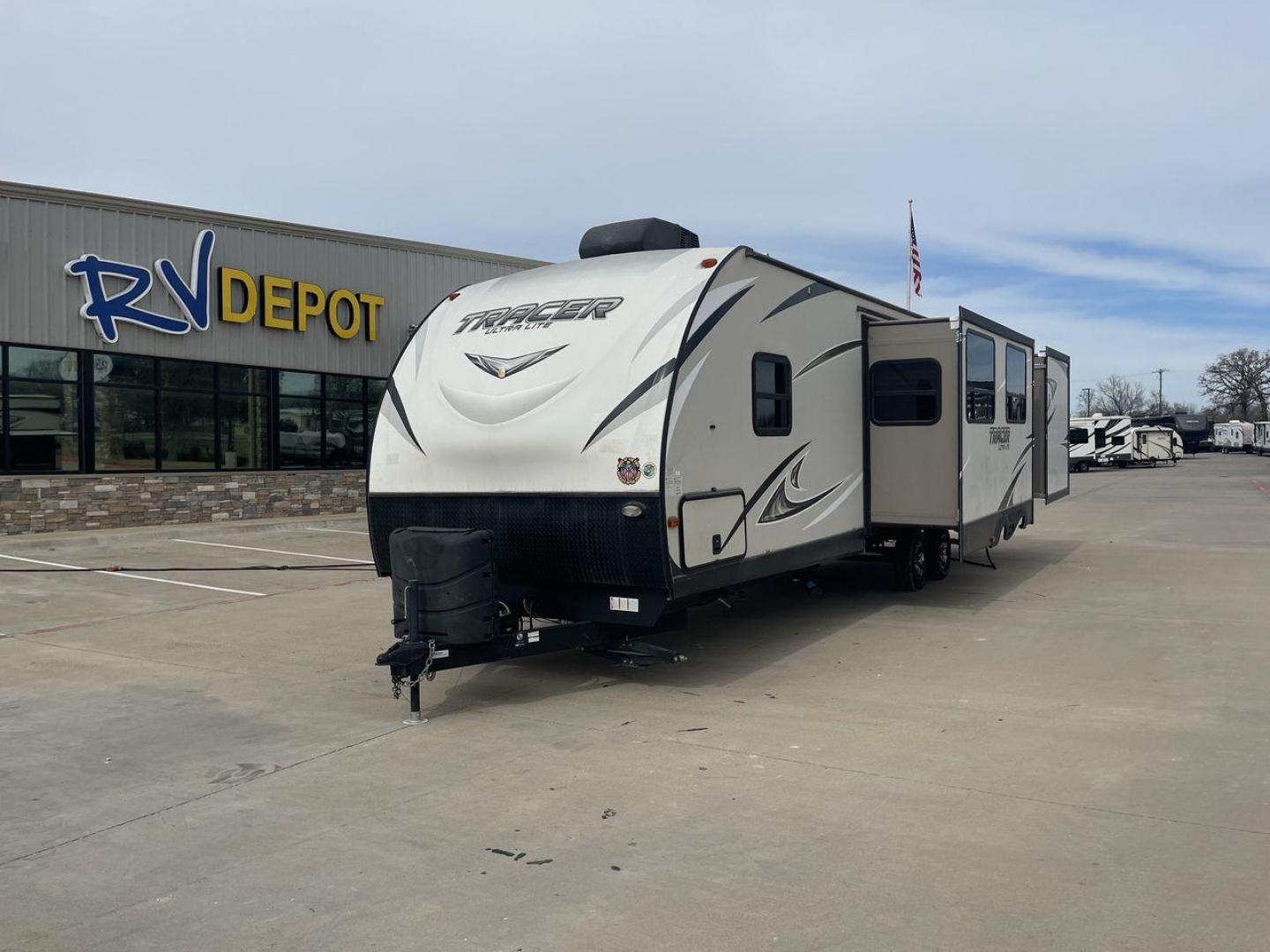 2017 TAN FOREST RIVER TRACER 3300BHD (5ZT2TRYB8HB) , Length: 37.58 ft. | Dry Weight: 7,520 lbs. | Slides: 2 transmission, located at 4319 N Main St, Cleburne, TX, 76033, (817) 678-5133, 32.385960, -97.391212 - The 2017 Forest River Tracer 3300 is a dual-axle aluminum wheel set-up measuring 37.58 ft. It has a dry weight of 7,520 lbs. It comes equipped with two power-retractable slides and a 19-foot power-retractable awning. Inside, you will find a bunkhouse, a queen-sized bed, and three convertible sofa be - Photo#0