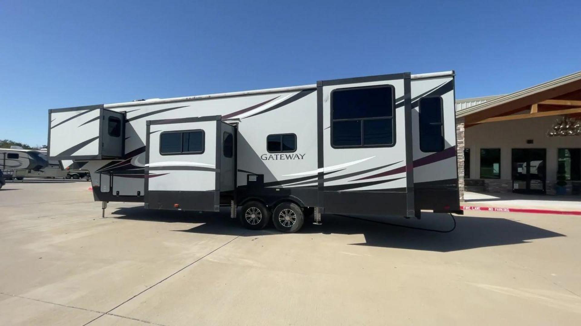 2017 TAN GATEWAY 3712RDMB - (5SFSG4228HE) , Length: 39.5 ft. | Dry Weight: 13,680 lbs. | Gross Weight: 15,500 lbs. | Slides: 4 transmission, located at 4319 N Main St, Cleburne, TX, 76033, (817) 678-5133, 32.385960, -97.391212 - The 2017 Gateway 3712RDMB Fifth Wheel provides luxurious travel experiences. With a length of 39.5 feet and a dry weight of 13,680 pounds, this amazing RV provides large living accommodations and all of the conveniences you require for a comfortable travel. With a gross weight of 15,500 pounds and f - Photo#1