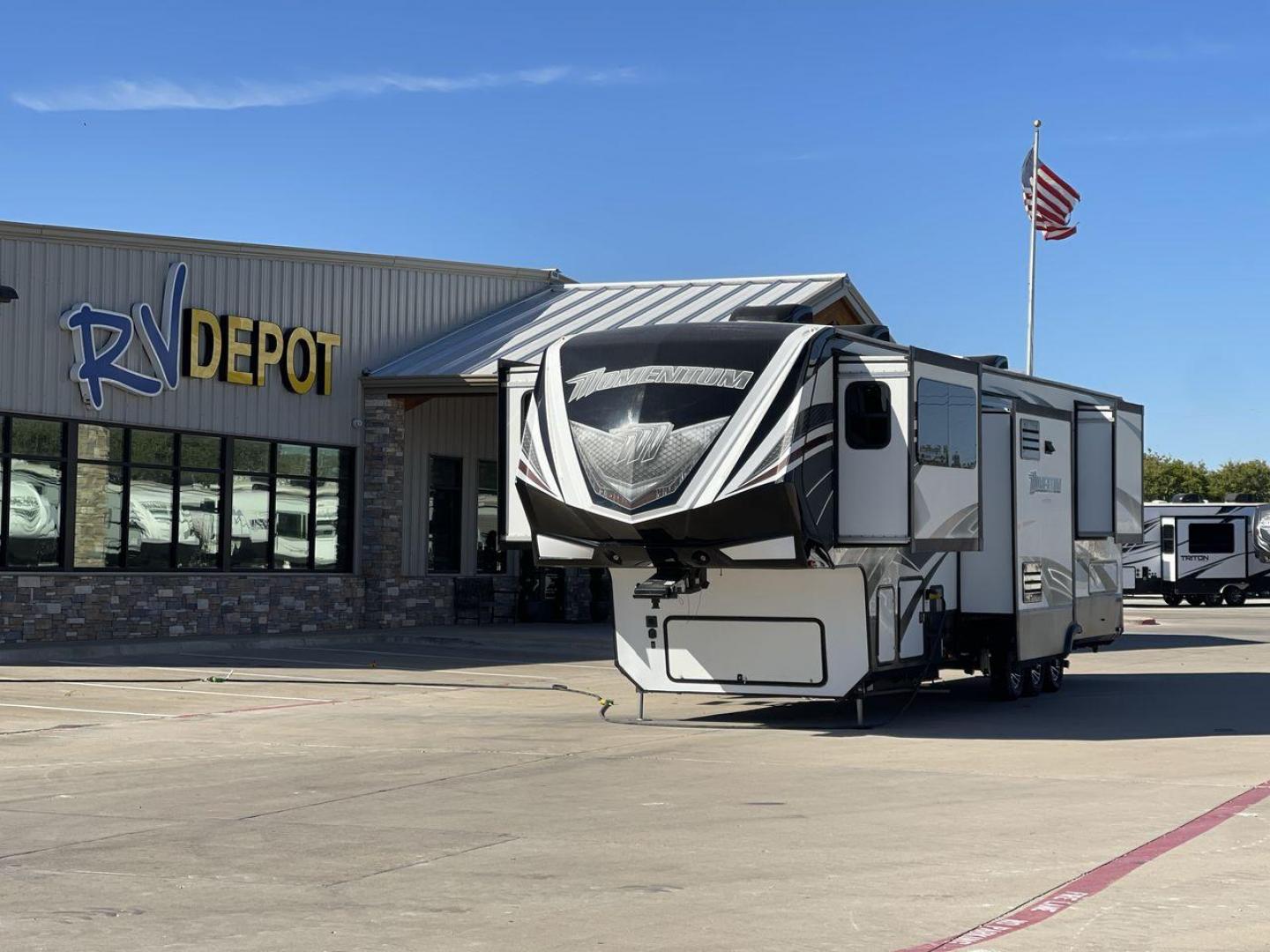 2017 GRAND DESIGN MOMENTUM 376TH (573FM4330H1) , Length: 41.25 ft. | Dry Weight: 15,900 lbs. | Gross Weight: 20,000 lbs. | Slides: 5 transmission, located at 4319 N Main St, Cleburne, TX, 76033, (817) 678-5133, 32.385960, -97.391212 - The 2017 Grand Design Momentum 376TH is a spacious fifth wheel. It measures 41.25 feet in length and built for comfort and convenience. With a dry weight of 15,900 lbs and a gross weight capacity of 20,000 lbs, this RV is sturdy and ready for adventure. It features five slide-outs, providing ample l - Photo#0