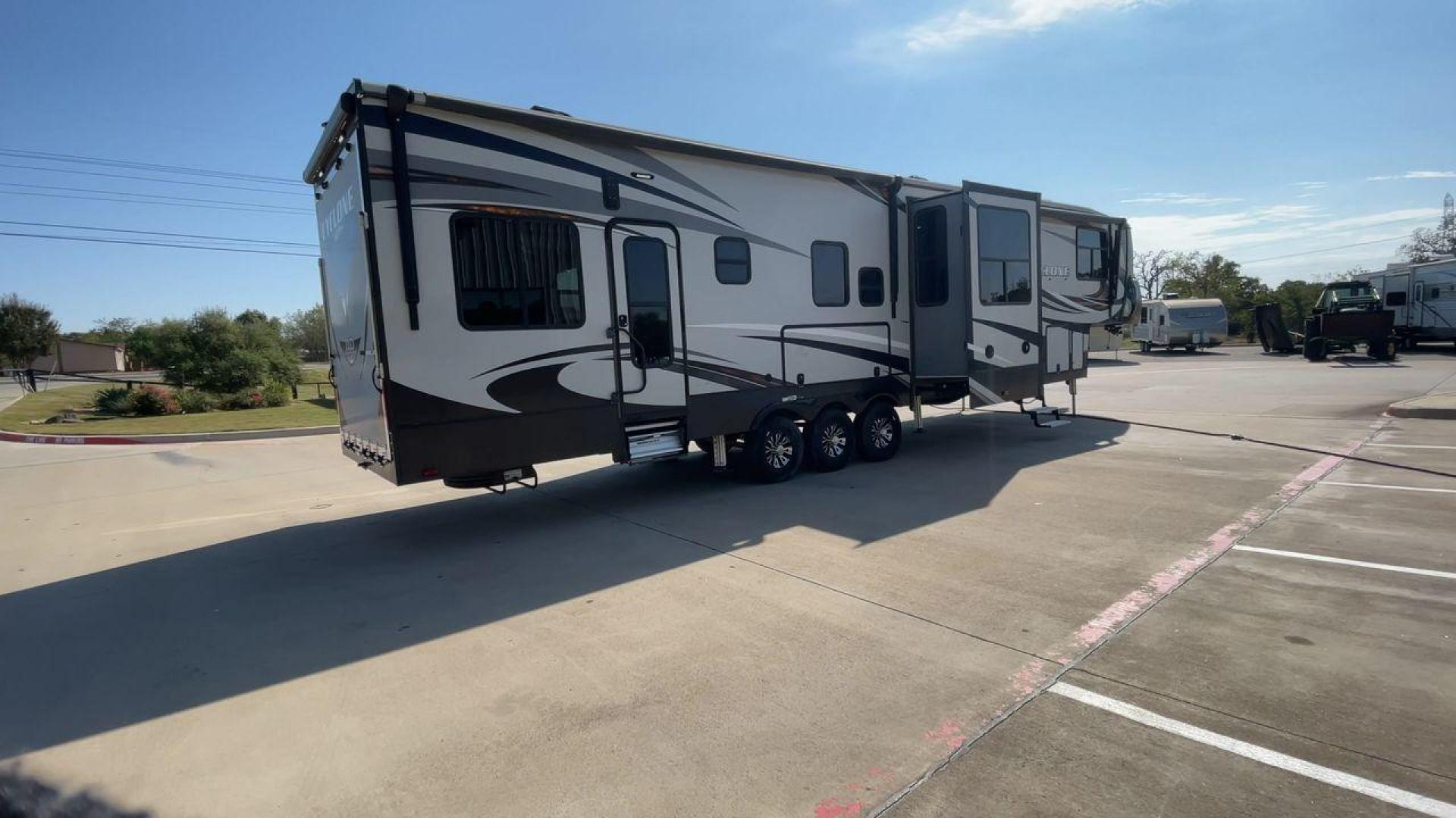 2017 HEARTLAND CYCLONE 4005 (5SFCG4434HE) , Length: 44.1 ft. | Dry Weight: 16,290 lbs.| Gross Weight: 20,000 lbs. | Slides: 3 transmission, located at 4319 N Main St, Cleburne, TX, 76033, (817) 678-5133, 32.385960, -97.391212 - The 2017 Heartland Cyclone 4005 is a luxury fifth-wheel toy hauler that combines comfort and functionality for adventurers who want the flexibility to bring toys along for the ride. Known for its spacious garage, upscale living area, and ample sleeping options, this model is ideal for thrill-seekers - Photo#1