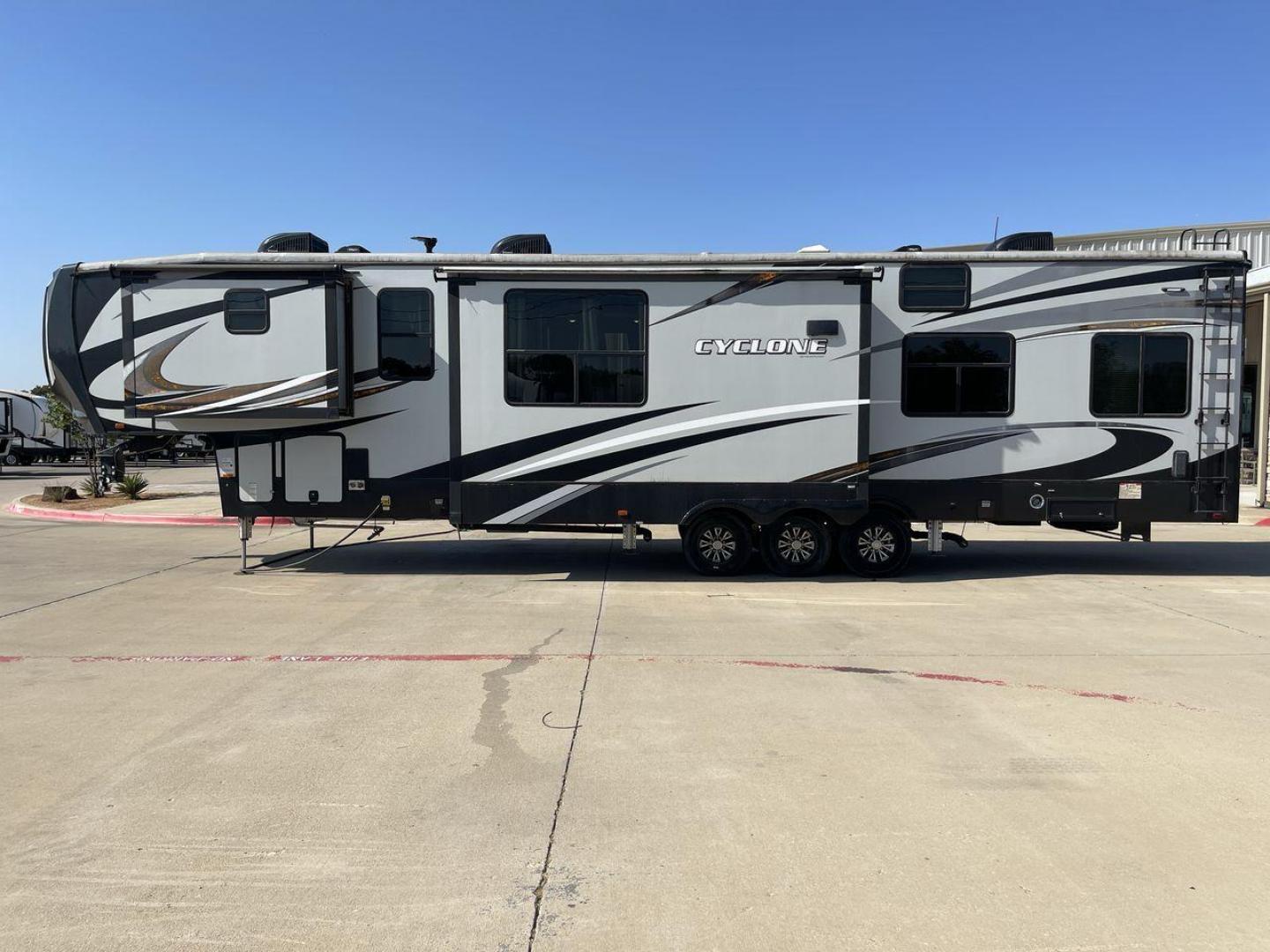 2017 HEARTLAND CYCLONE 4005 (5SFCG4434HE) , Length: 44.1 ft. | Dry Weight: 16,290 lbs.| Gross Weight: 20,000 lbs. | Slides: 3 transmission, located at 4319 N Main St, Cleburne, TX, 76033, (817) 678-5133, 32.385960, -97.391212 - The 2017 Heartland Cyclone 4005 is a luxury fifth-wheel toy hauler that combines comfort and functionality for adventurers who want the flexibility to bring toys along for the ride. Known for its spacious garage, upscale living area, and ample sleeping options, this model is ideal for thrill-seekers - Photo#24