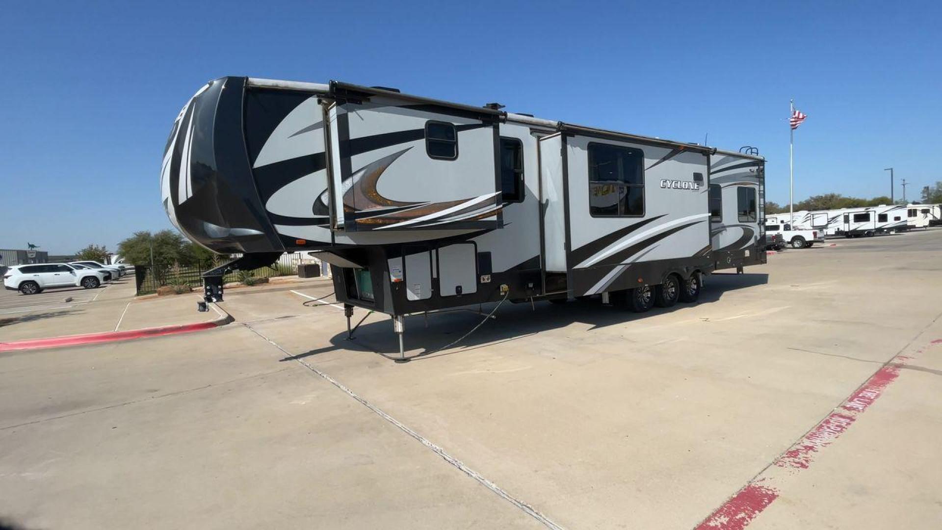 2017 HEARTLAND CYCLONE 4005 (5SFCG4434HE) , Length: 44.1 ft. | Dry Weight: 16,290 lbs.| Gross Weight: 20,000 lbs. | Slides: 3 transmission, located at 4319 N Main St, Cleburne, TX, 76033, (817) 678-5133, 32.385960, -97.391212 - The 2017 Heartland Cyclone 4005 is a luxury fifth-wheel toy hauler that combines comfort and functionality for adventurers who want the flexibility to bring toys along for the ride. Known for its spacious garage, upscale living area, and ample sleeping options, this model is ideal for thrill-seekers - Photo#5