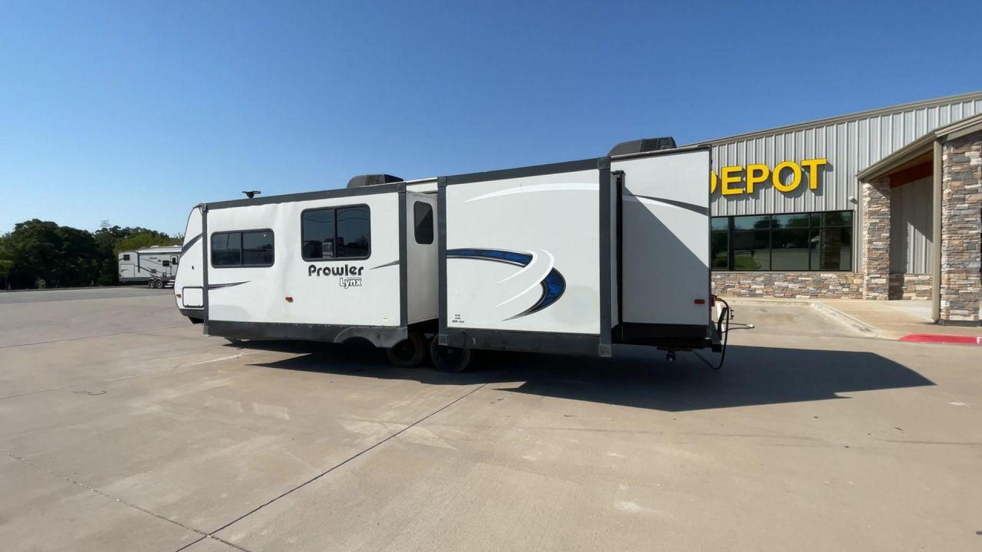 2017 HEARTLAND PROWLER 32LX (5SFPB3622JE) , Length: 36.4 ft. | Dry Weight: 7,880 lbs | Gross Weight: 9,000 lbs | Slides: 2 transmission, located at 4319 N Main St, Cleburne, TX, 76033, (817) 678-5133, 32.385960, -97.391212 - The 2017 Heartland Prowler 32LX travel trailer has dimensions of 36.4 ft in length, 8 ft width, 11.2 ft height, and 6.8 ft interior height. It has a base weight of 7,880 lbs with a 9,000 lbs GVWR and a carrying capacity of 1,120 lbs. This unit highlights an outdoor kitchen, a rear bunkhouse, a p - Photo#7