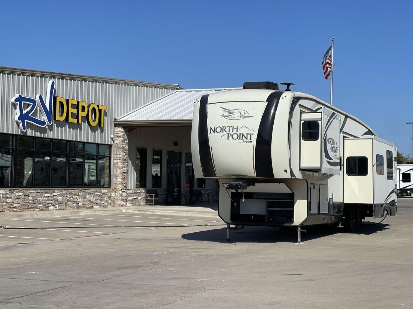 2017 TAN JAYCO NORTH POINT 375BHFS (1UJCJ0BV2H1) , Length: 43.25 ft.| Dry Weight: 13,740 lbs. | Gross Weight: 16,500 lbs. | Slides: 5 transmission, located at 4319 N Main St, Cleburne, TX, 76033, (817) 678-5133, 32.385960, -97.391212 - Five slides, one-and-a-half baths, a bunkhouse, and an outdoor kitchen are just some of the highlights of this North Point fifth wheel model 375BHFS by Jayco. This fifth wheel measures 43.25 ft in length, 8 ft in width, 13.33 ft in height, and 6.83 ft in interior height. It has a dry weight of 1 - Photo#0