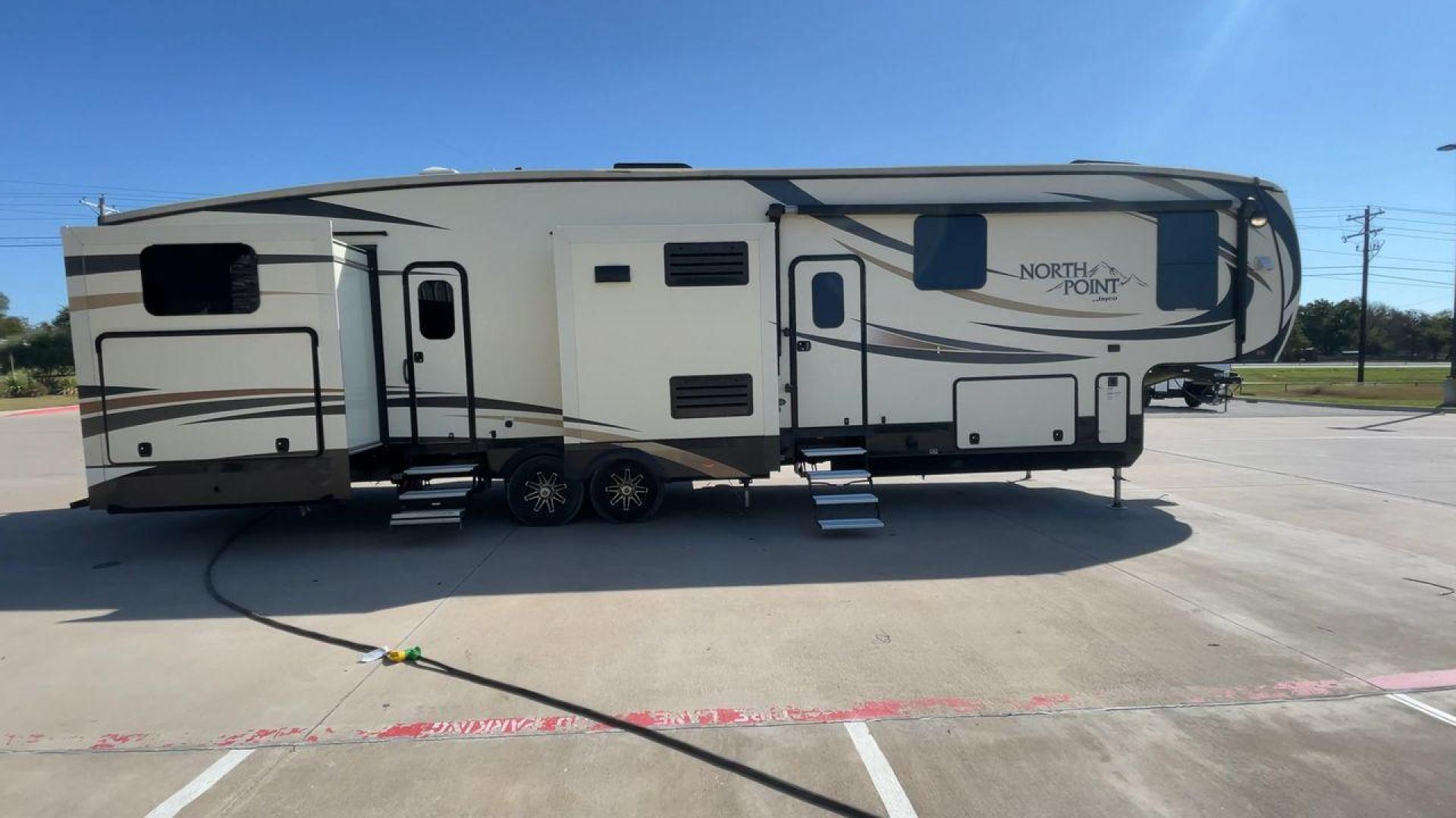 2017 TAN JAYCO NORTH POINT 375BHFS (1UJCJ0BV2H1) , Length: 43.25 ft.| Dry Weight: 13,740 lbs. | Gross Weight: 16,500 lbs. | Slides: 5 transmission, located at 4319 N Main St, Cleburne, TX, 76033, (817) 678-5133, 32.385960, -97.391212 - Five slides, one-and-a-half baths, a bunkhouse, and an outdoor kitchen are just some of the highlights of this North Point fifth wheel model 375BHFS by Jayco. This fifth wheel measures 43.25 ft in length, 8 ft in width, 13.33 ft in height, and 6.83 ft in interior height. It has a dry weight of 1 - Photo#2