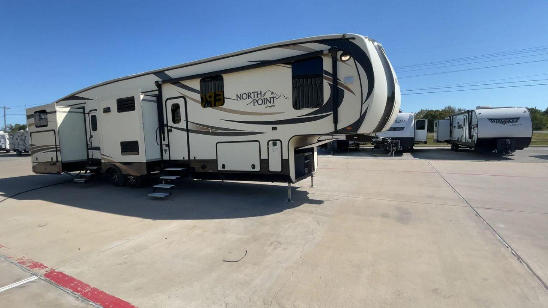 2017 TAN JAYCO NORTH POINT 375BHFS (1UJCJ0BV2H1) , Length: 43.25 ft.| Dry Weight: 13,740 lbs. | Gross Weight: 16,500 lbs. | Slides: 5 transmission, located at 4319 N Main St, Cleburne, TX, 76033, (817) 678-5133, 32.385960, -97.391212 - Five slides, one-and-a-half baths, a bunkhouse, and an outdoor kitchen are just some of the highlights of this North Point fifth wheel model 375BHFS by Jayco. This fifth wheel measures 43.25 ft in length, 8 ft in width, 13.33 ft in height, and 6.83 ft in interior height. It has a dry weight of 1 - Photo#3