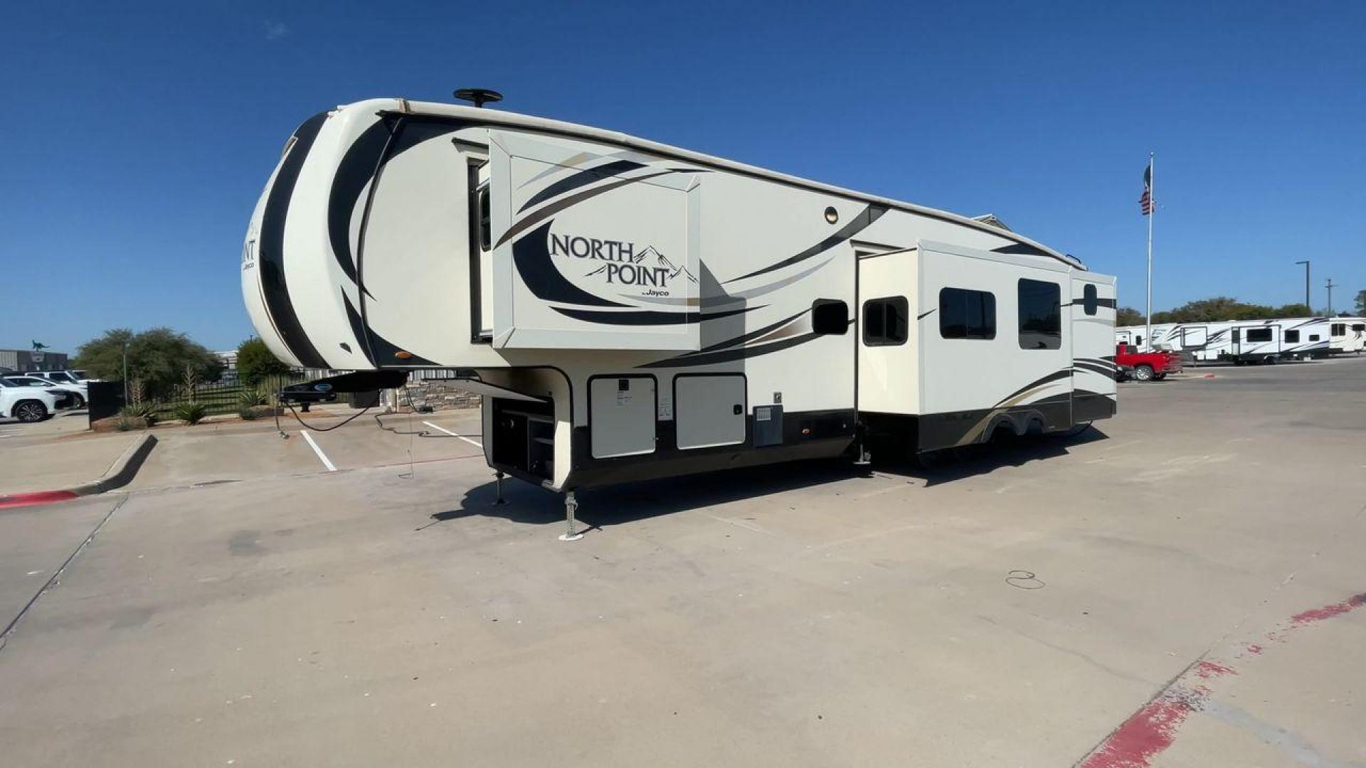 2017 TAN JAYCO NORTH POINT 375BHFS (1UJCJ0BV2H1) , Length: 43.25 ft.| Dry Weight: 13,740 lbs. | Gross Weight: 16,500 lbs. | Slides: 5 transmission, located at 4319 N Main St, Cleburne, TX, 76033, (817) 678-5133, 32.385960, -97.391212 - Five slides, one-and-a-half baths, a bunkhouse, and an outdoor kitchen are just some of the highlights of this North Point fifth wheel model 375BHFS by Jayco. This fifth wheel measures 43.25 ft in length, 8 ft in width, 13.33 ft in height, and 6.83 ft in interior height. It has a dry weight of 1 - Photo#5