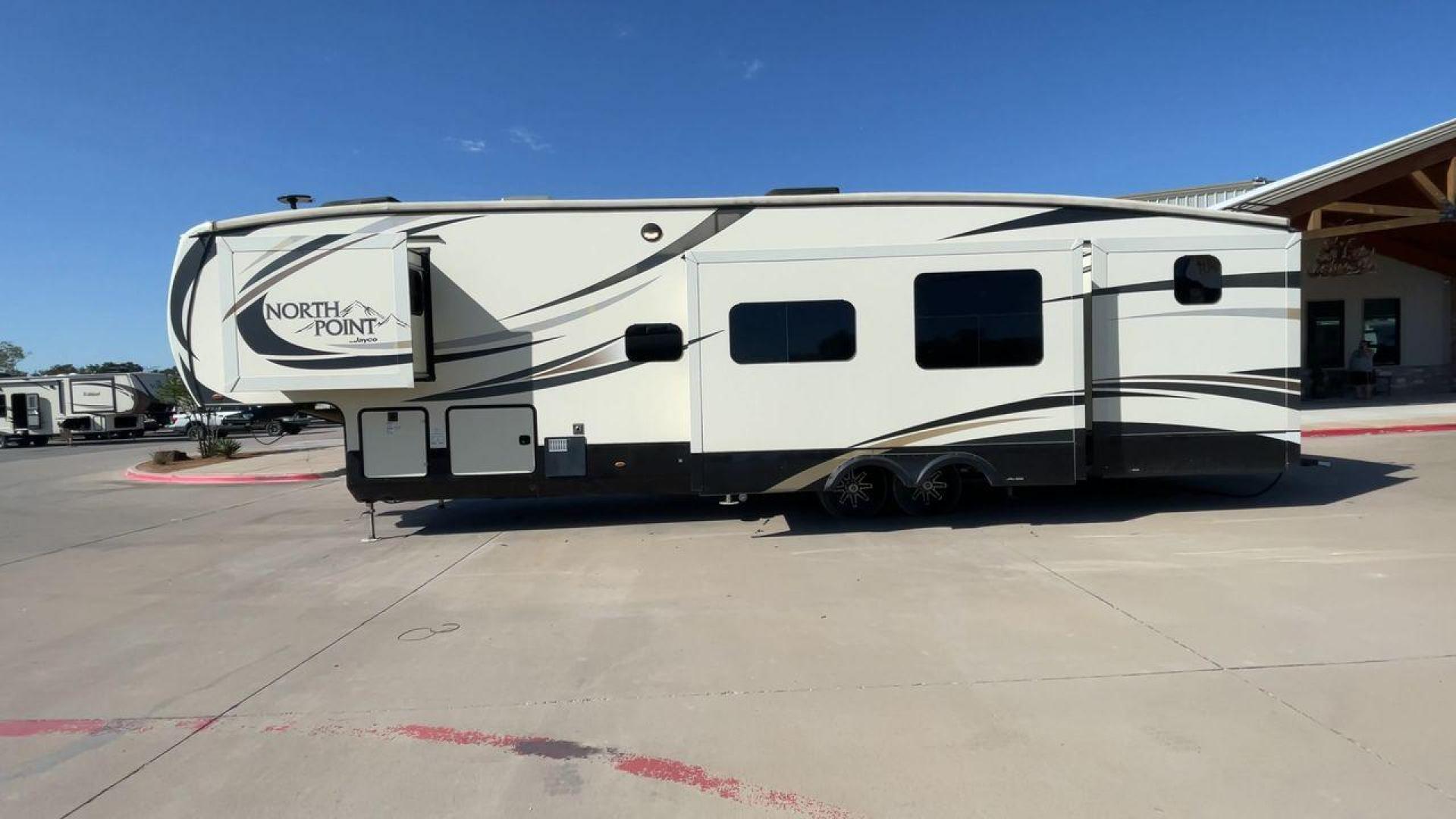 2017 TAN JAYCO NORTH POINT 375BHFS (1UJCJ0BV2H1) , Length: 43.25 ft.| Dry Weight: 13,740 lbs. | Gross Weight: 16,500 lbs. | Slides: 5 transmission, located at 4319 N Main St, Cleburne, TX, 76033, (817) 678-5133, 32.385960, -97.391212 - Five slides, one-and-a-half baths, a bunkhouse, and an outdoor kitchen are just some of the highlights of this North Point fifth wheel model 375BHFS by Jayco. This fifth wheel measures 43.25 ft in length, 8 ft in width, 13.33 ft in height, and 6.83 ft in interior height. It has a dry weight of 1 - Photo#6