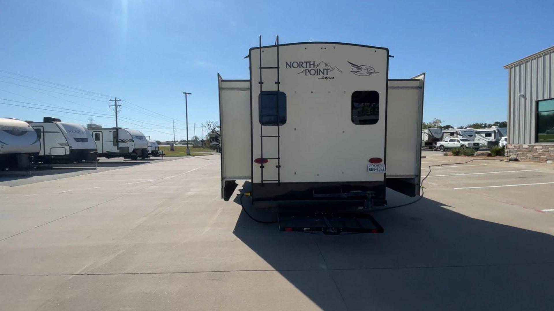 2017 TAN JAYCO NORTH POINT 375BHFS (1UJCJ0BV2H1) , Length: 43.25 ft.| Dry Weight: 13,740 lbs. | Gross Weight: 16,500 lbs. | Slides: 5 transmission, located at 4319 N Main St, Cleburne, TX, 76033, (817) 678-5133, 32.385960, -97.391212 - Five slides, one-and-a-half baths, a bunkhouse, and an outdoor kitchen are just some of the highlights of this North Point fifth wheel model 375BHFS by Jayco. This fifth wheel measures 43.25 ft in length, 8 ft in width, 13.33 ft in height, and 6.83 ft in interior height. It has a dry weight of 1 - Photo#8