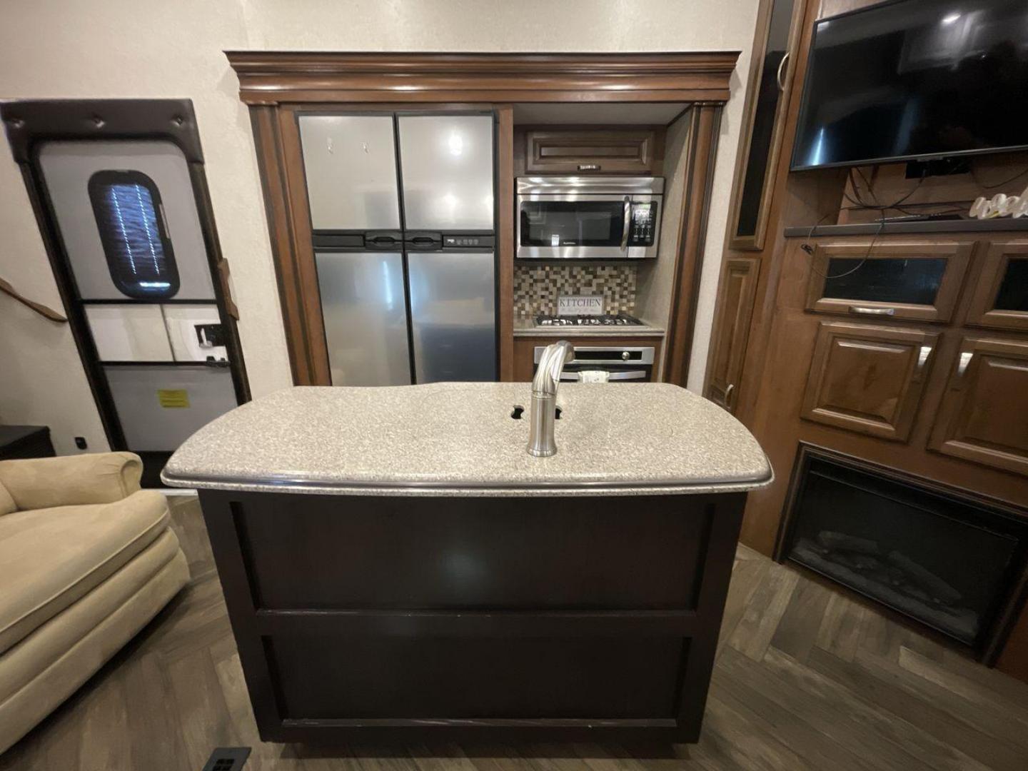 2017 TAN JAYCO NORTH POINT 375BHFS (1UJCJ0BV2H1) , Length: 43.25 ft.| Dry Weight: 13,740 lbs. | Gross Weight: 16,500 lbs. | Slides: 5 transmission, located at 4319 N Main St, Cleburne, TX, 76033, (817) 678-5133, 32.385960, -97.391212 - Five slides, one-and-a-half baths, a bunkhouse, and an outdoor kitchen are just some of the highlights of this North Point fifth wheel model 375BHFS by Jayco. This fifth wheel measures 43.25 ft in length, 8 ft in width, 13.33 ft in height, and 6.83 ft in interior height. It has a dry weight of 1 - Photo#9