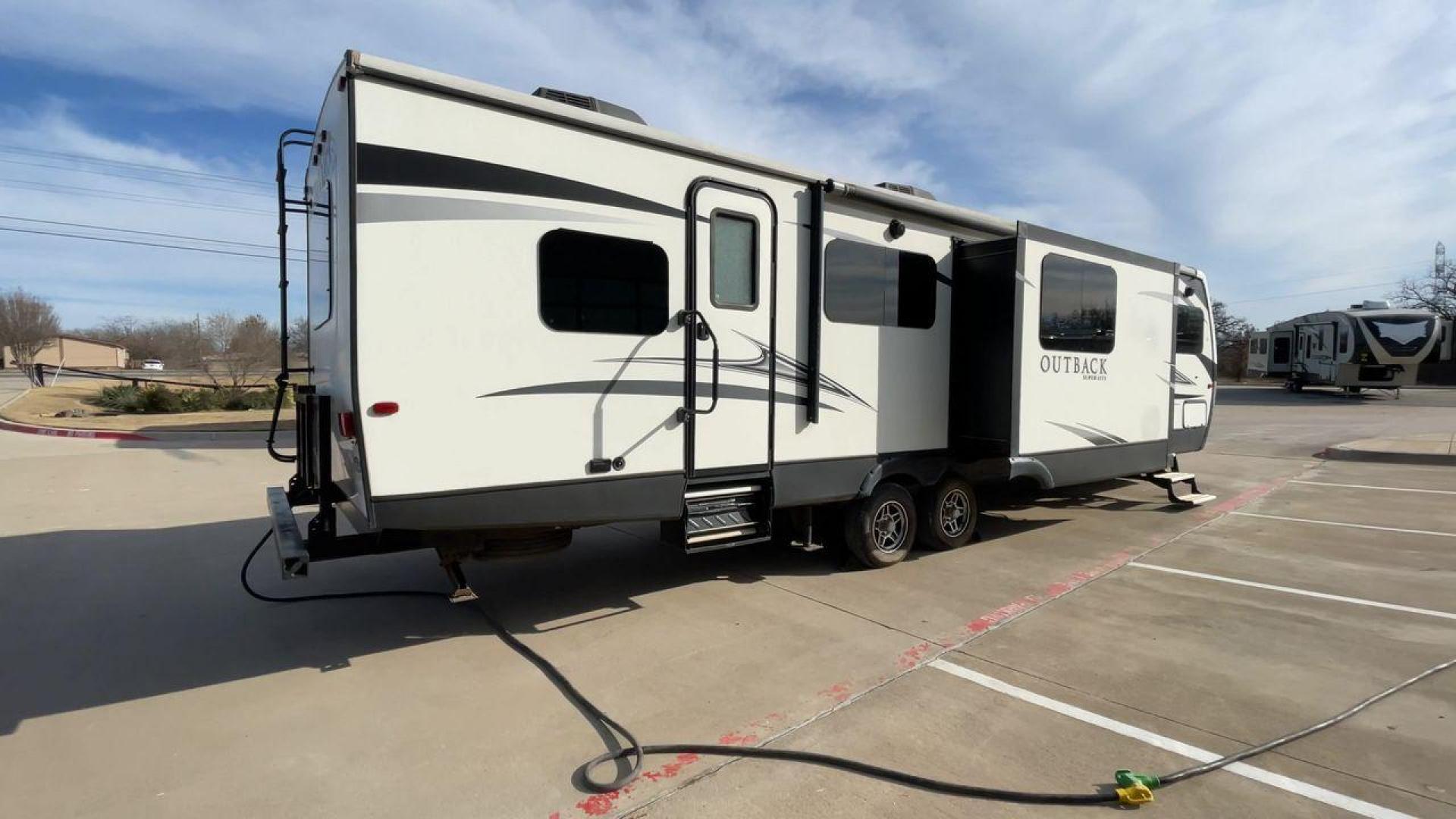 2017 KEYSTONE OUTBACK 332FK (4YDT33229HB) , Length: 37.83 ft. | Dry Weight: 8,475 lbs. | Gross Weight: 10,500 lbs. | Slides: 3 transmission, located at 4319 N Main St, Cleburne, TX, 76033, (817) 678-5133, 32.385960, -97.391212 - Photo#1