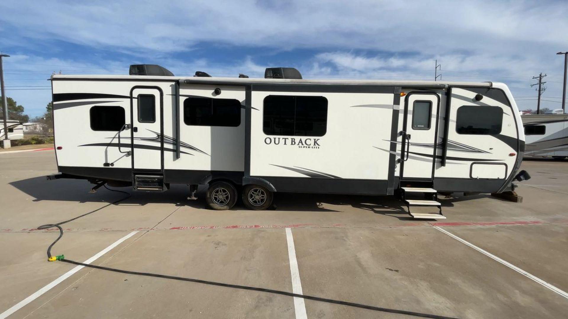 2017 KEYSTONE OUTBACK 332FK (4YDT33229HB) , Length: 37.83 ft. | Dry Weight: 8,475 lbs. | Gross Weight: 10,500 lbs. | Slides: 3 transmission, located at 4319 N Main St, Cleburne, TX, 76033, (817) 678-5133, 32.385960, -97.391212 - Photo#2