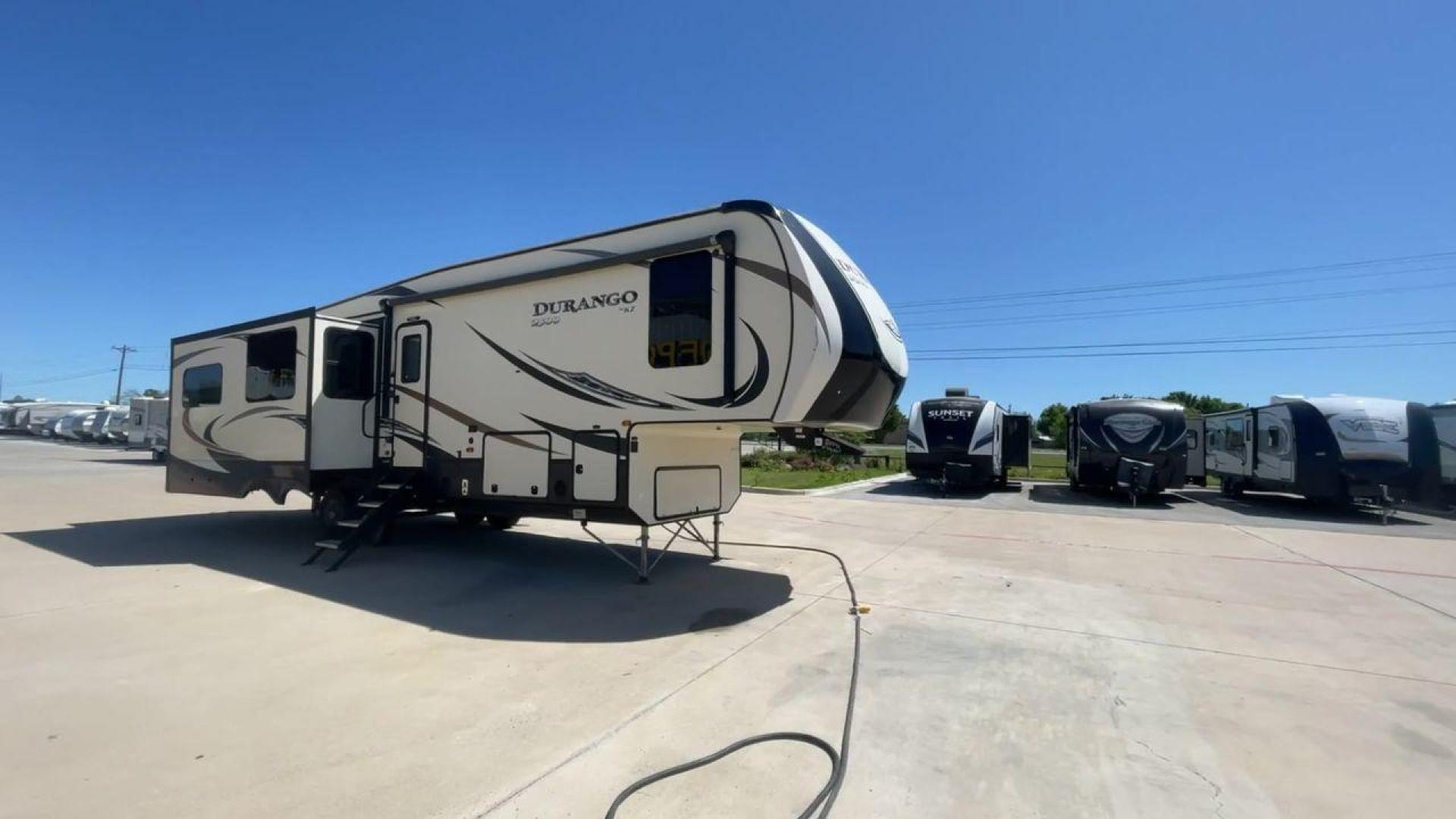 2017 TAN KZ DURANGO 336RET (4EZFD3324H6) , Length: 35.33 ft. | Dry Weight: 10,070 lbs. | Gross Weight: 12,500 lbs. | Slides: 3 transmission, located at 4319 N Main St, Cleburne, TX, 76033, (817) 678-5133, 32.385960, -97.391212 - The 2017 K-Z Durango 336RET is a fantastic residential fifth wheel with numerous luxurious features you will enjoy in an RV! This Durango measures 35.33 ft. in length and 12.83 ft. in height. It has a dry weight of 10,070 lbs. and a GVWR of 12,500 lbs. You will be able to pull this fifth wheel with - Photo#3