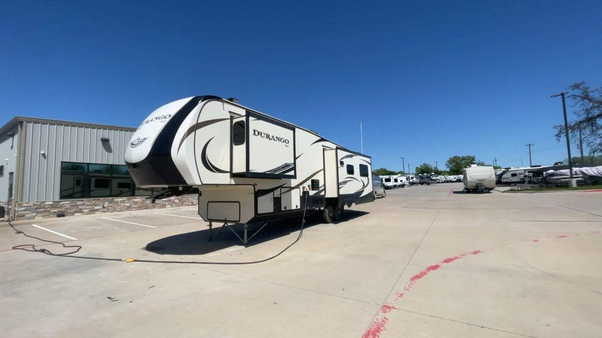 2017 TAN KZ DURANGO 336RET (4EZFD3324H6) , Length: 35.33 ft. | Dry Weight: 10,070 lbs. | Gross Weight: 12,500 lbs. | Slides: 3 transmission, located at 4319 N Main St, Cleburne, TX, 76033, (817) 678-5133, 32.385960, -97.391212 - The 2017 K-Z Durango 336RET is a fantastic residential fifth wheel with numerous luxurious features you will enjoy in an RV! This Durango measures 35.33 ft. in length and 12.83 ft. in height. It has a dry weight of 10,070 lbs. and a GVWR of 12,500 lbs. You will be able to pull this fifth wheel with - Photo#5