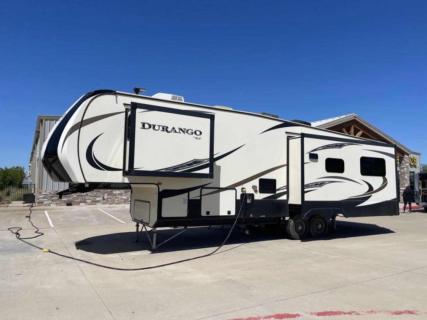 2017 TAN KZ DURANGO 336RET (4EZFD3324H6) , Length: 35.33 ft. | Dry Weight: 10,070 lbs. | Gross Weight: 12,500 lbs. | Slides: 3 transmission, located at 4319 N Main St, Cleburne, TX, 76033, (817) 678-5133, 32.385960, -97.391212 - The 2017 K-Z Durango 336RET is a fantastic residential fifth wheel with numerous luxurious features you will enjoy in an RV! This Durango measures 35.33 ft. in length and 12.83 ft. in height. It has a dry weight of 10,070 lbs. and a GVWR of 12,500 lbs. You will be able to pull this fifth wheel with - Photo#24